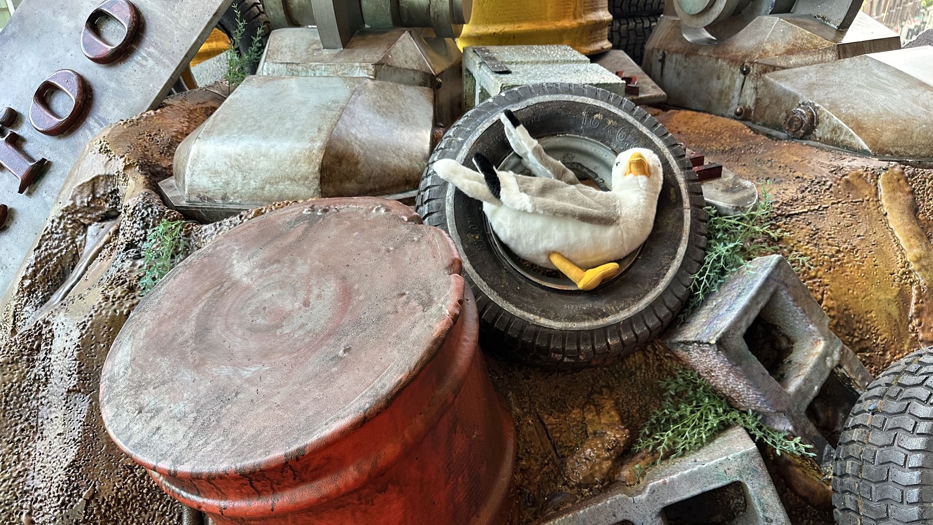 Townie, Axios Boston's plush gullscot, is chillin inside a tire near some cinderblocks in an undisclosed location around Boston. 
