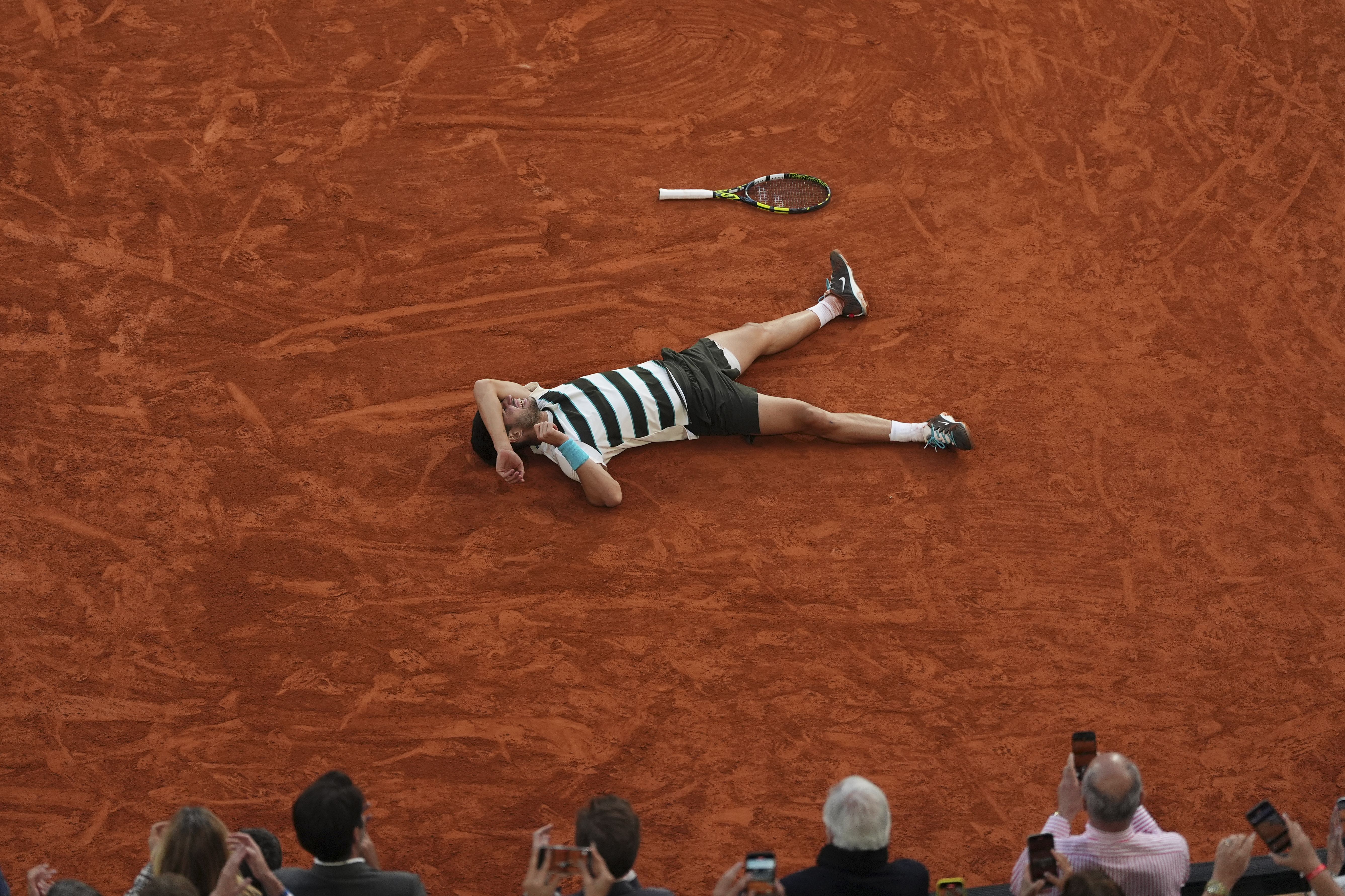 Carlos Alcaraz celebrates after winning the French Open yesterday.