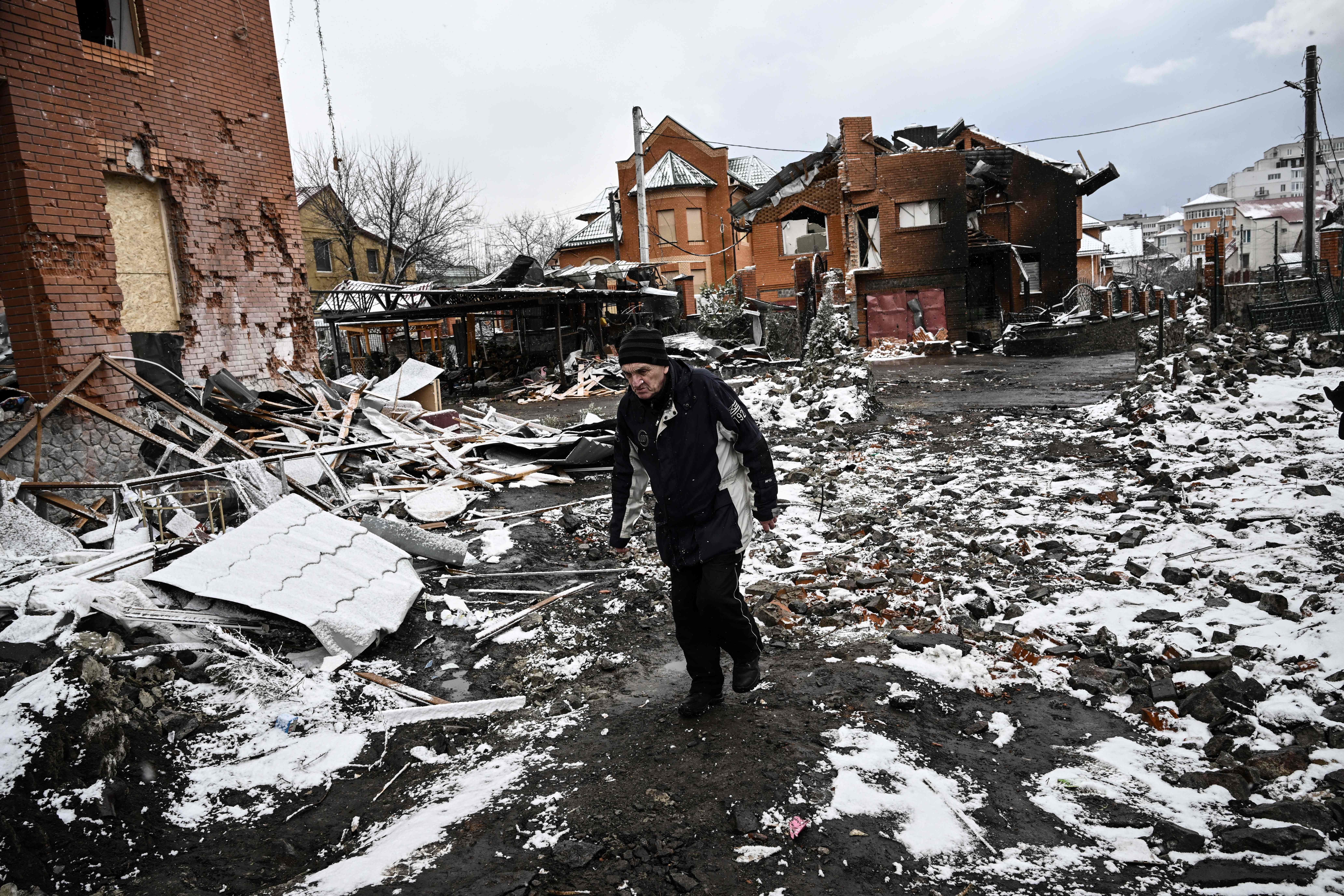  A man walks between houses destroyed during air strikes on the central Ukranian city of Bila Tserkva on March 8.