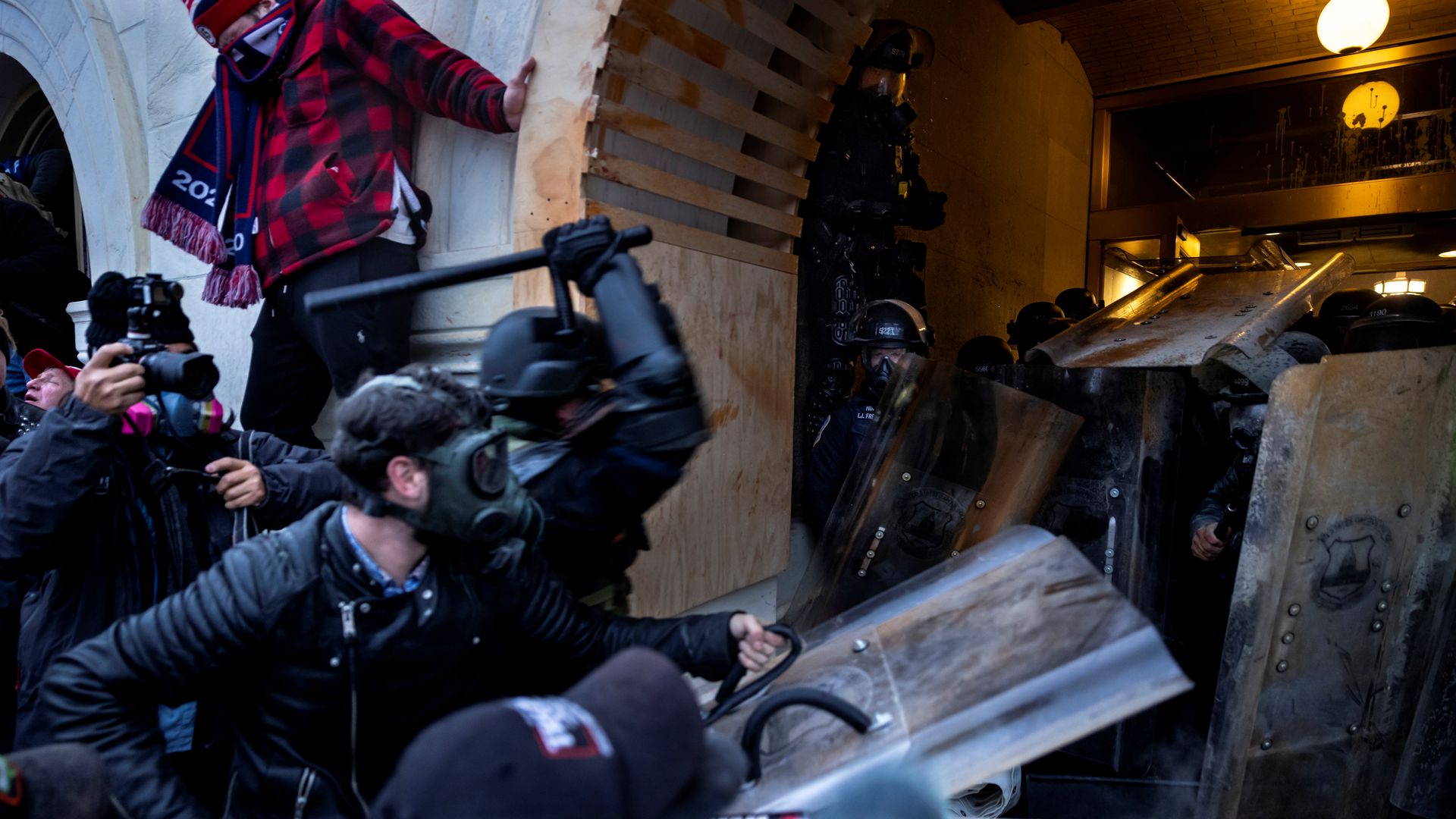 Trump supporters clash with police and security forces as people try to storm the US Capitol on January 6