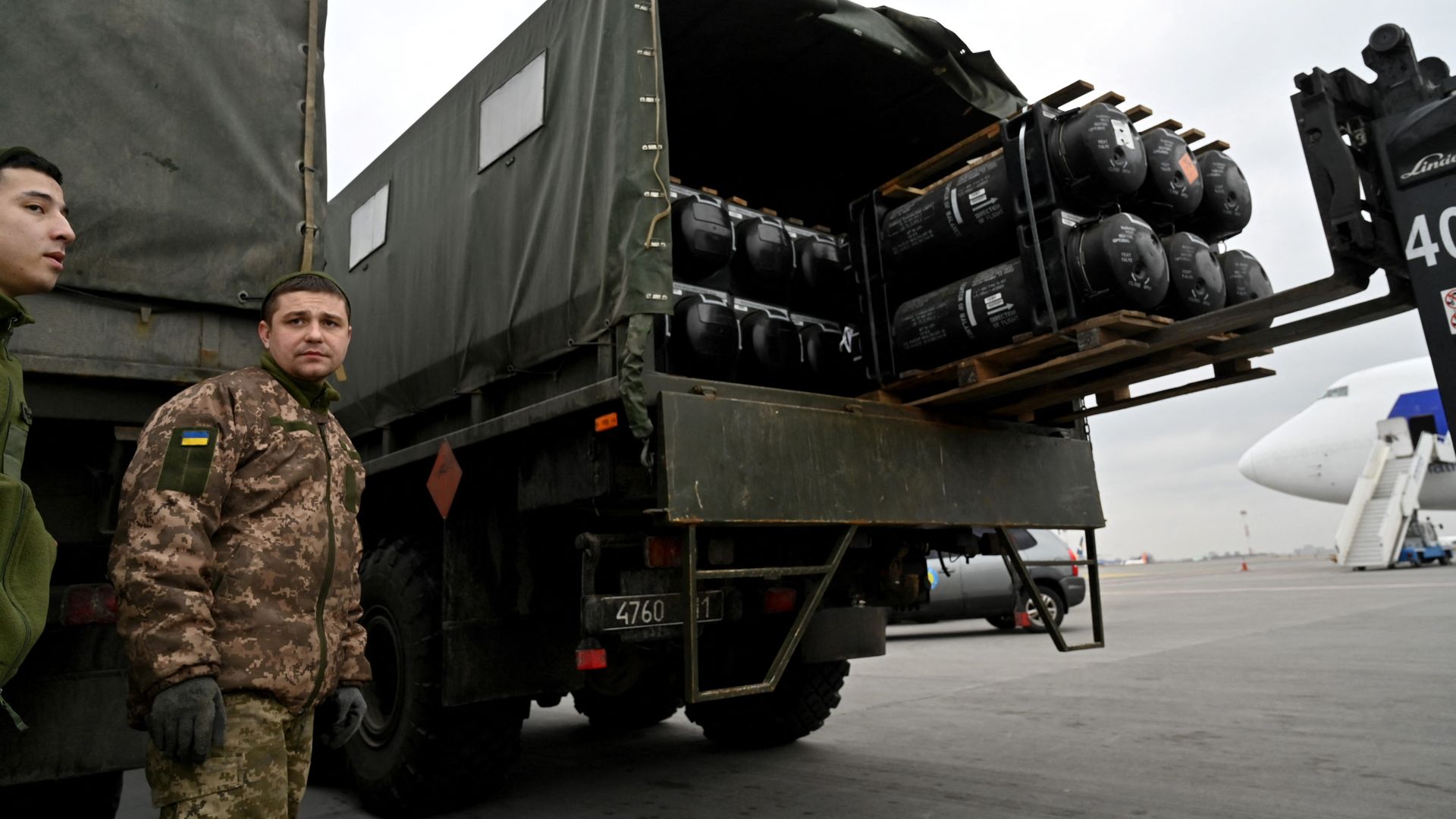 U.S.-made Javelin anti-tank systems are seen being unloaded at Kyiv's airport before Russia's invasion.