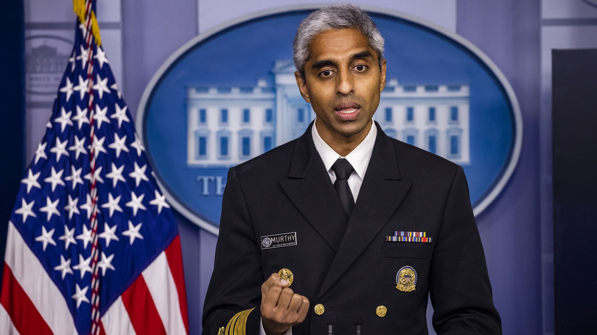 Surgeon General Vivek Murthy speaks from the White House press briefing room podium