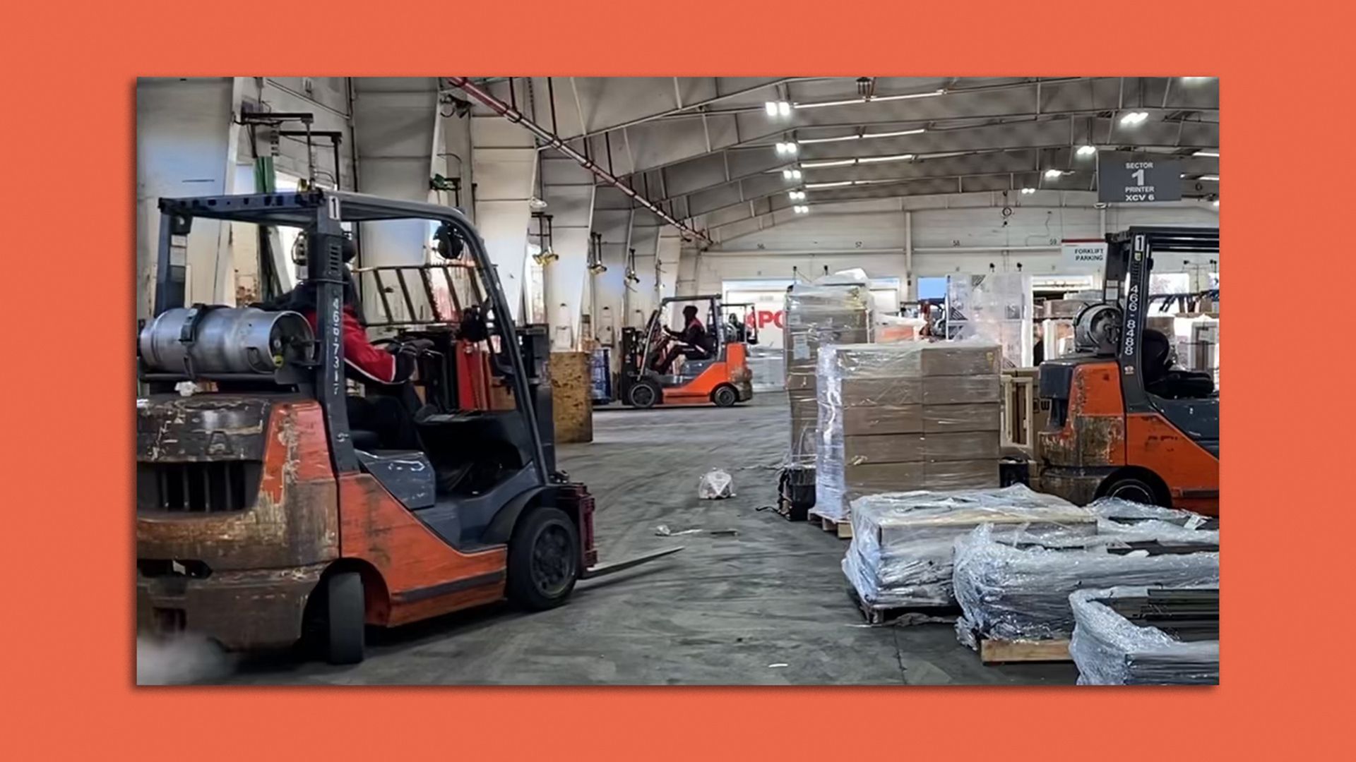 logistics workers at an XPO dock warehouse driving forklifts 