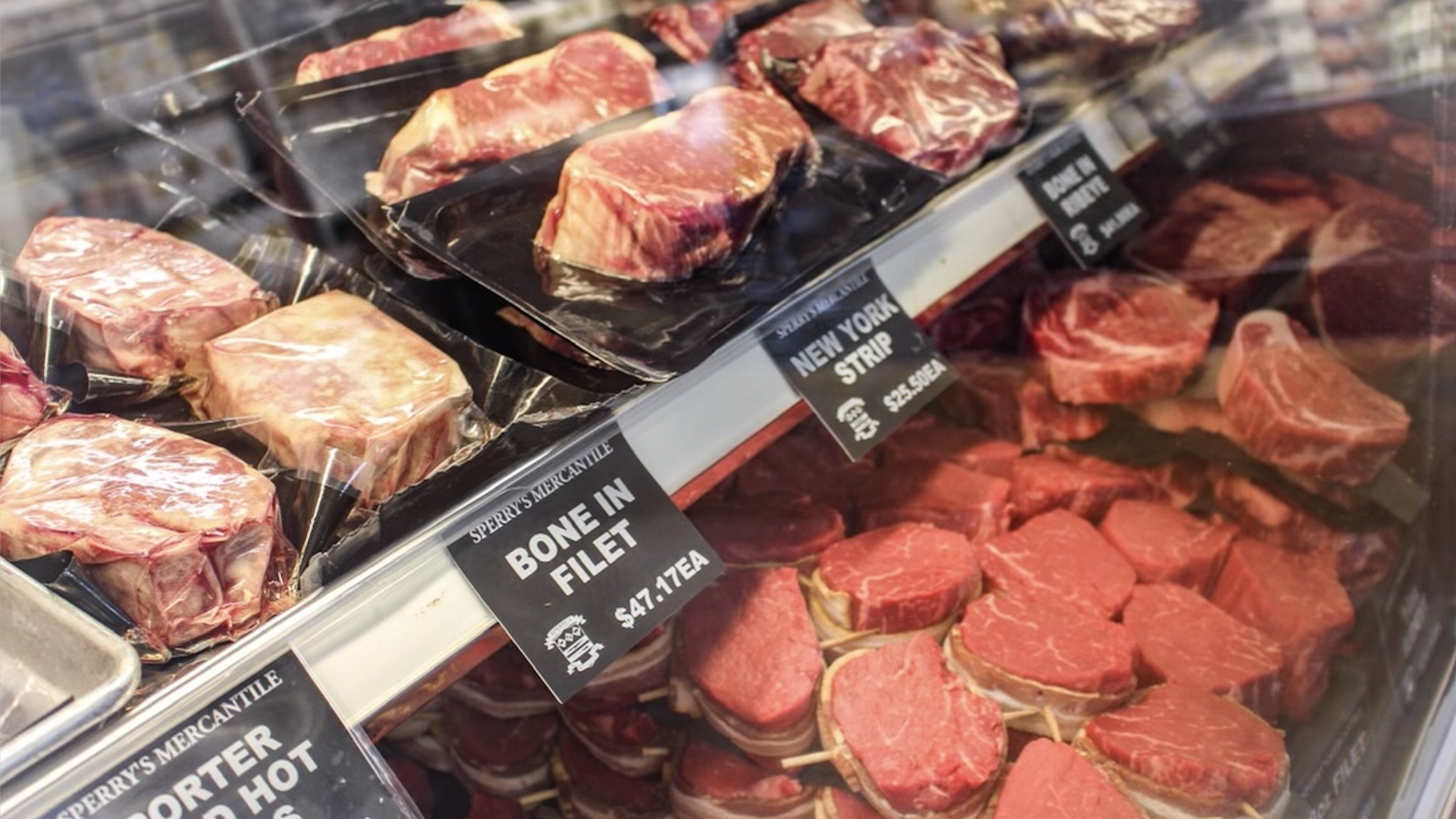 Meat displayed in a deli counter.