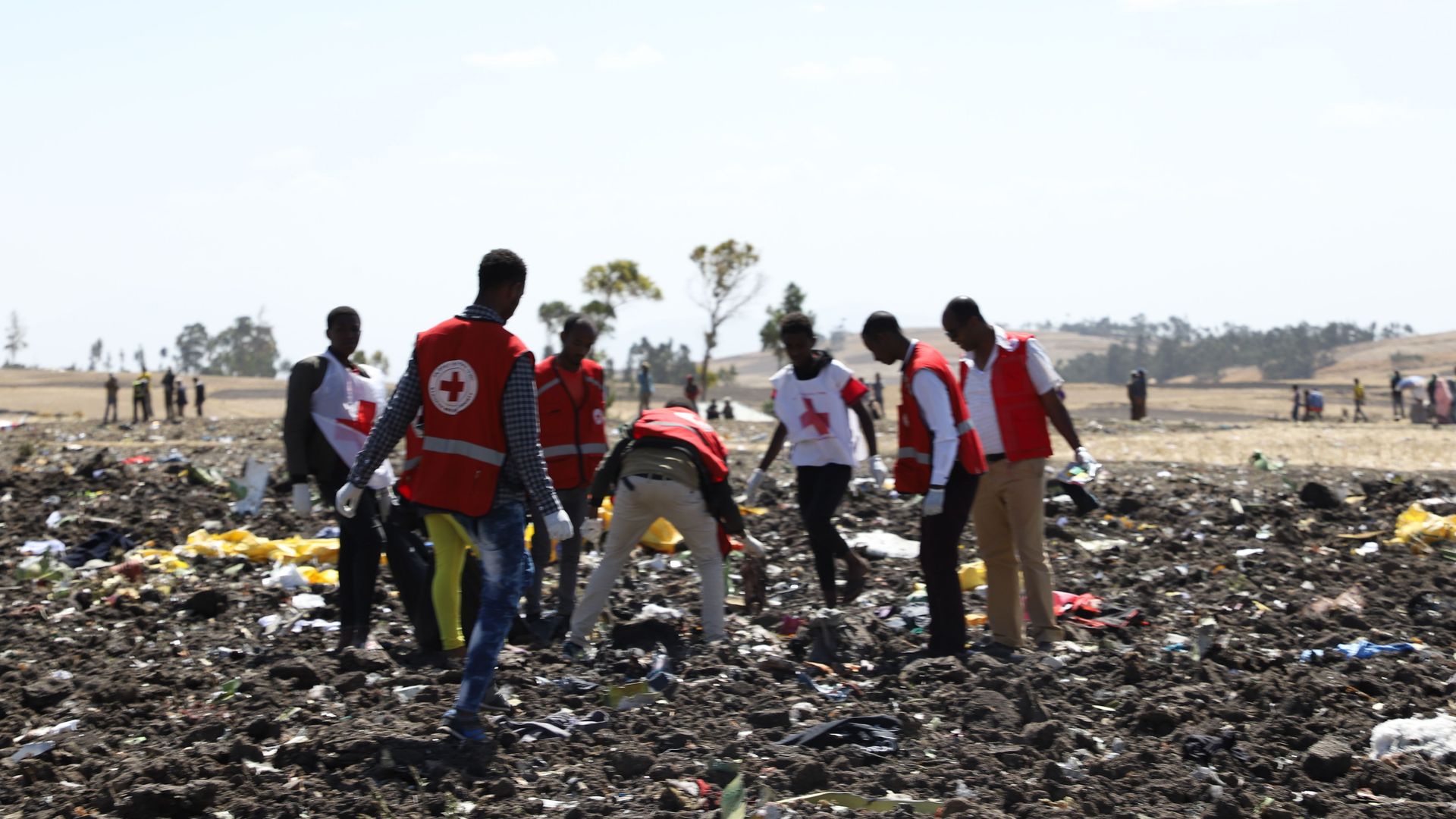 Red cross team work amid debris at the crash site of Ethiopia Airlines