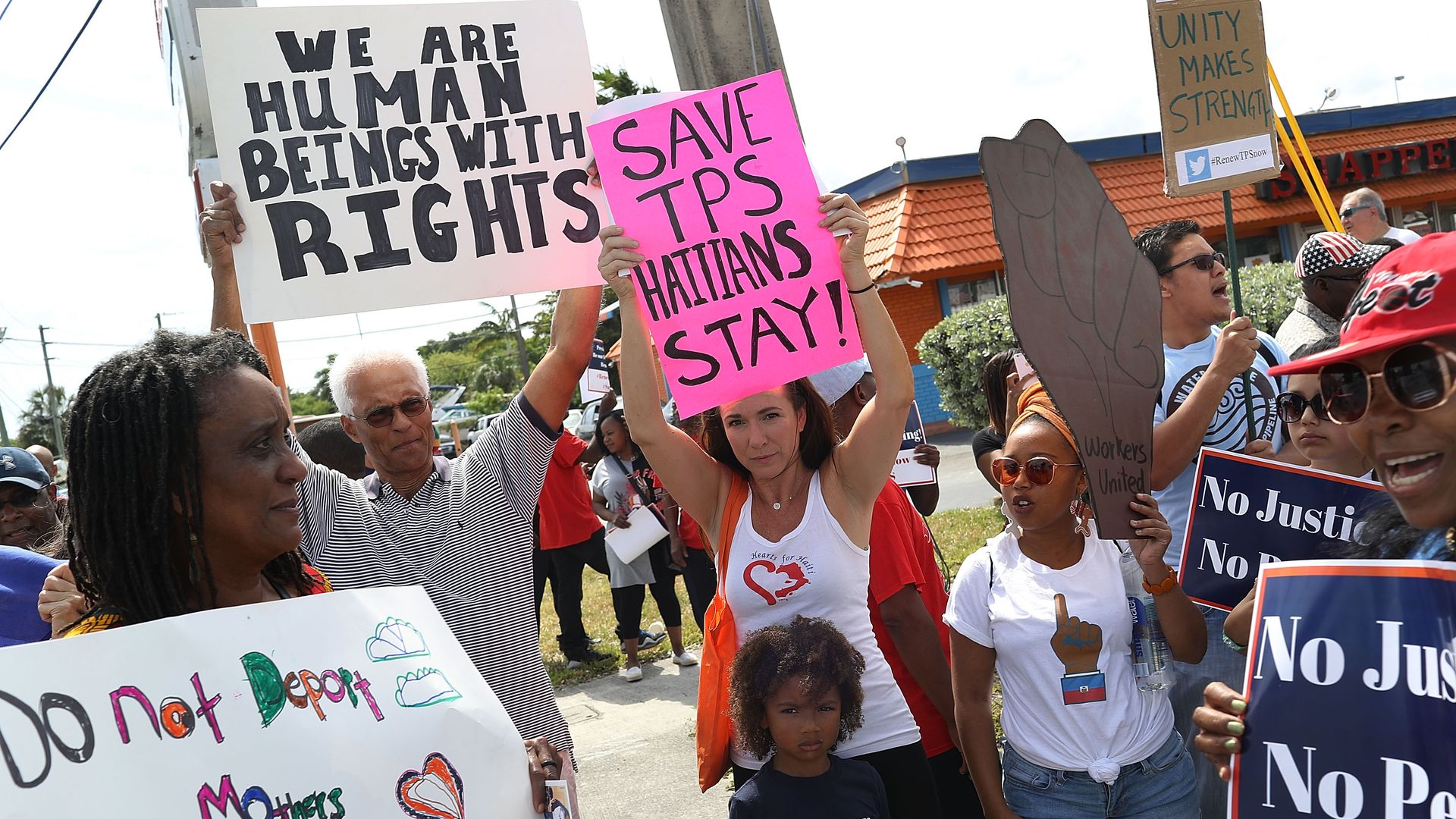 Demonstration over termination of the Temporary Protected Status for Haitians in Miami, Florida. Photo: Joe Raedle/Getty Images)
