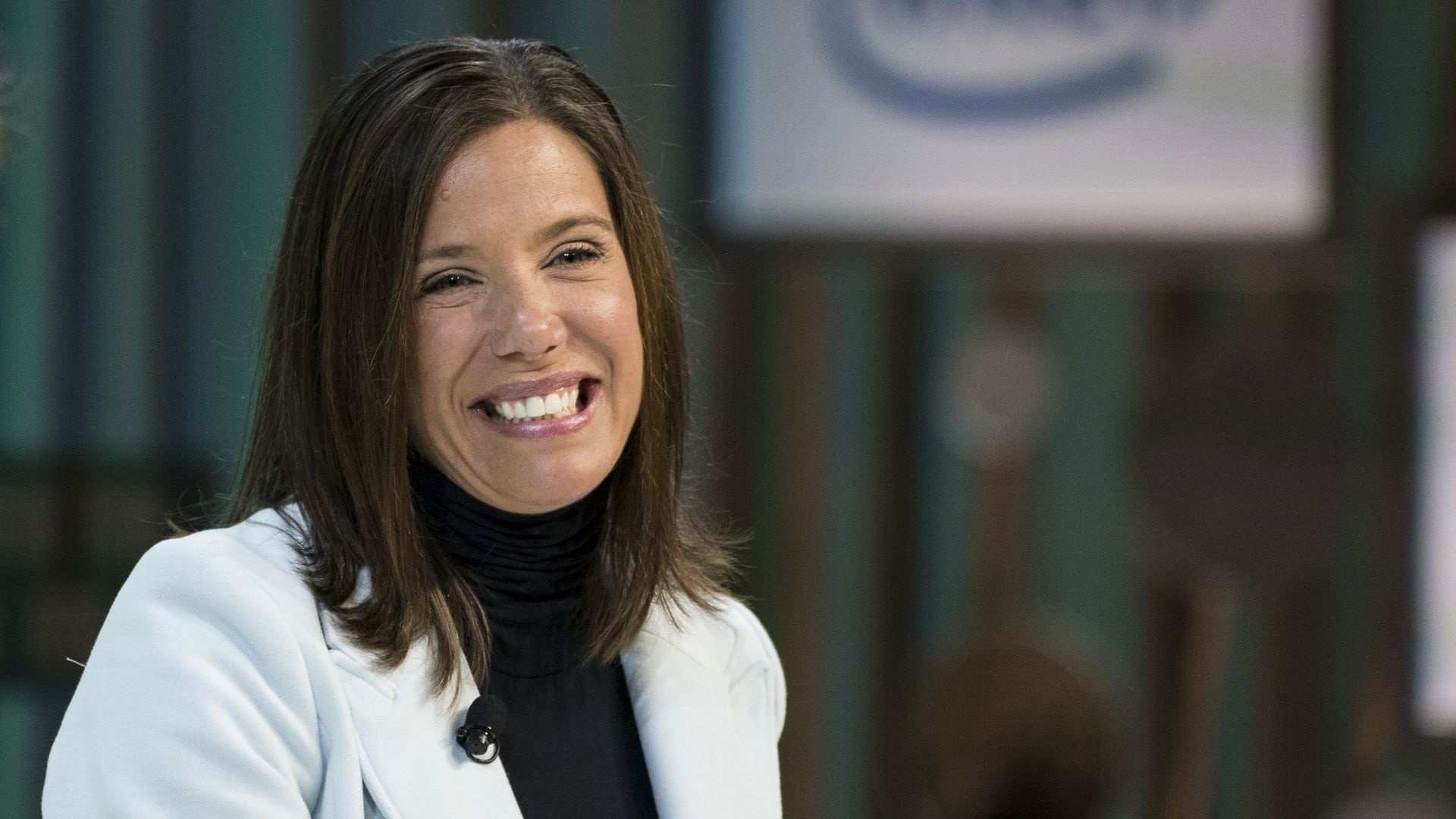 Best Buy CEO Corie Barry wears a white coat and black shirt 