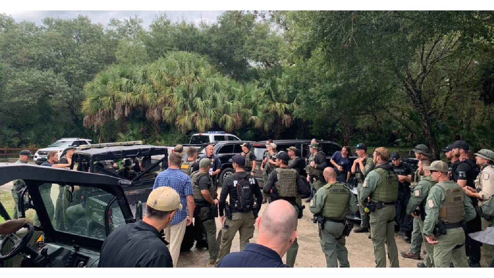 Law enforcement officials gather to search the Carlton Reserve for Brian Laundrie.