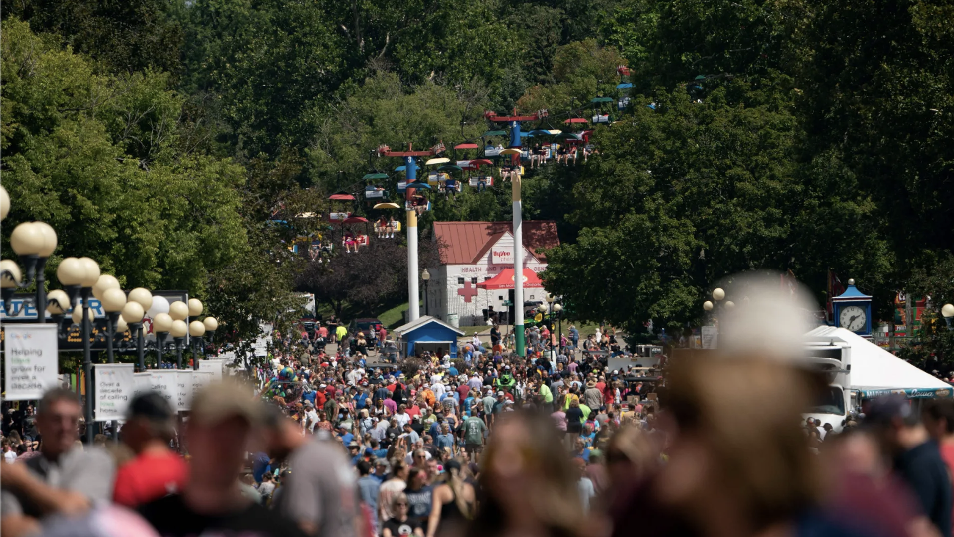 a crowd at the main drag of the iowa state fair