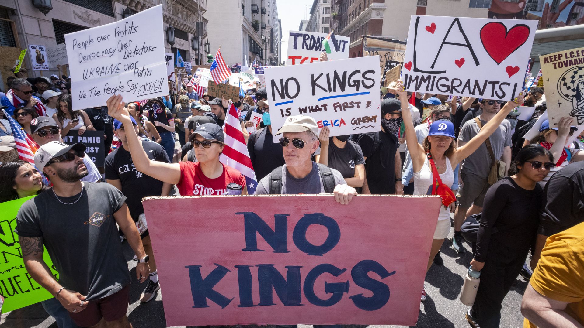 Demonstrators take part in a protest against the Trump administration during the "No Kings" national rally in downtown Los Angeles, California