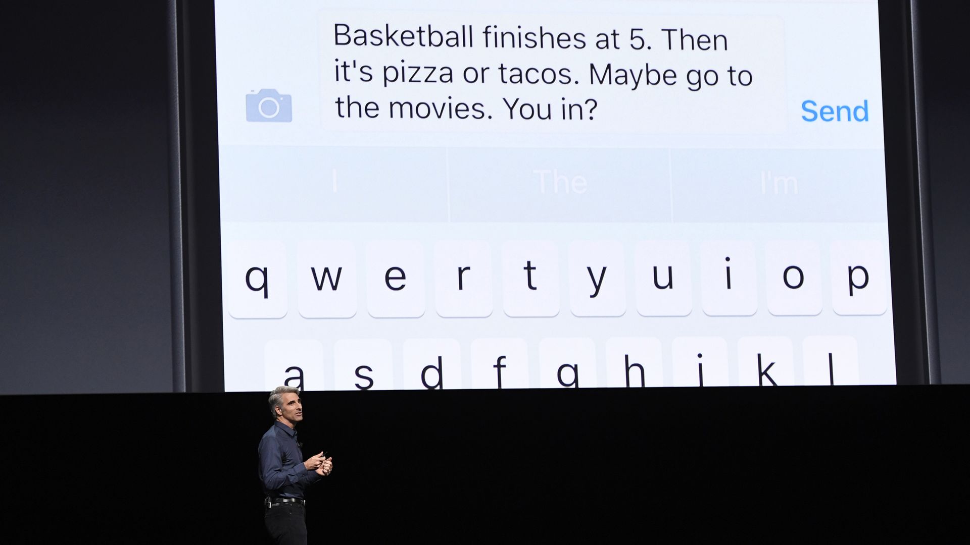 Apple executive Craig Federighi showing off new messaging features of iOS