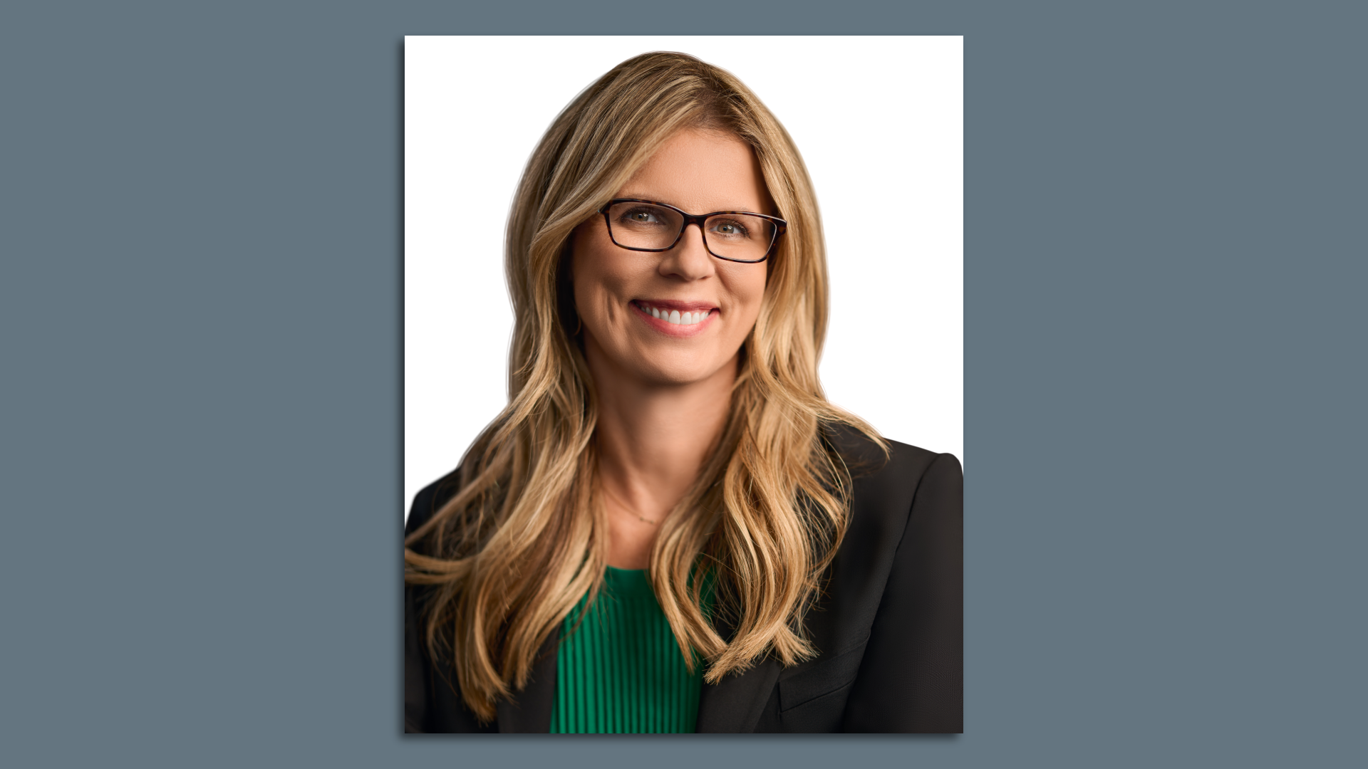 Photo of a woman posing for camera in a headshot 