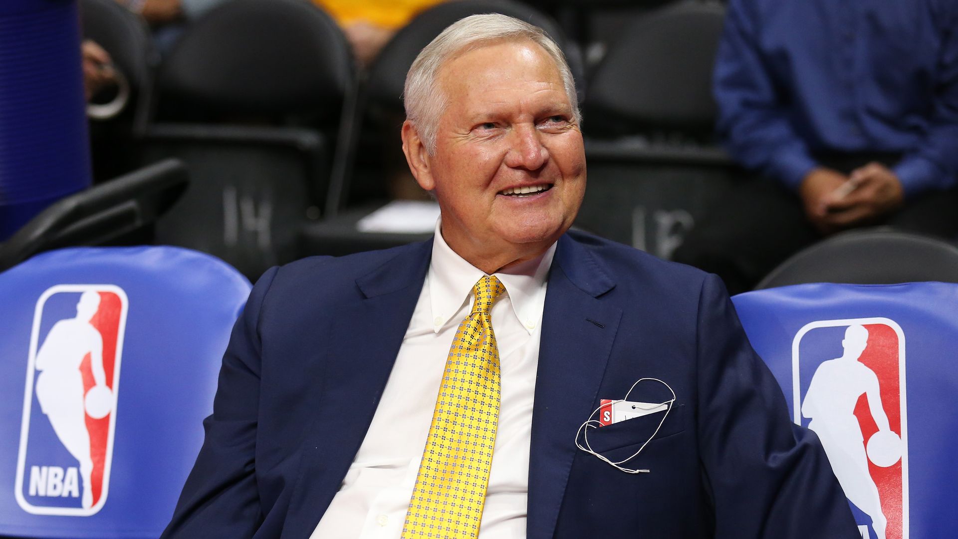  Golden State Warriors executive board member Jerry West sits on the bench by NBA logos before the game the Los Angeles Clippers at Staples Center on March 31, 2015.