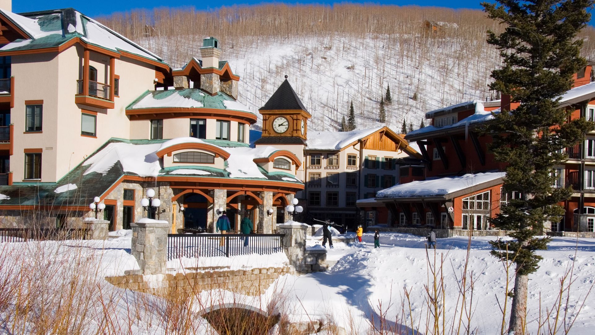 A resort surrounded by piles of snow.