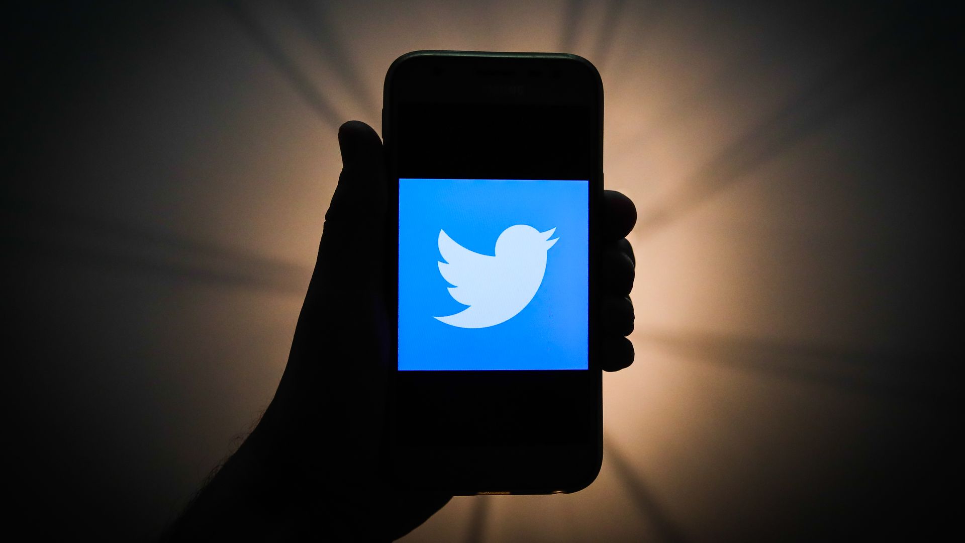 Twitter logo is seen displayed on a phone screen in this illustration photo taken in Krakow, Poland on November 13, 2019. 