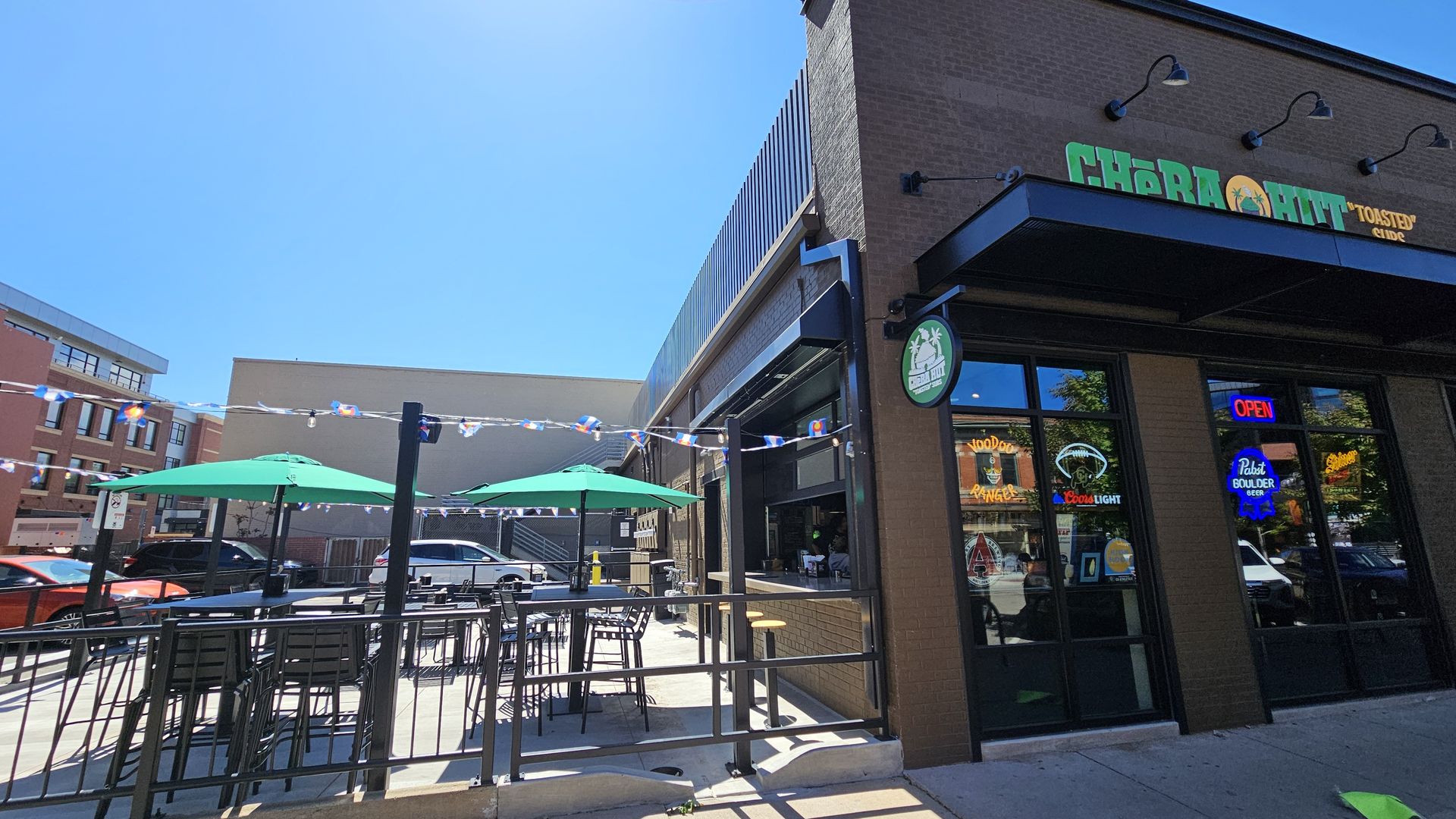 Cheba Hut's downtown Boulder location can be seen, with its outdoor patio next to its indoor dining area and bar.