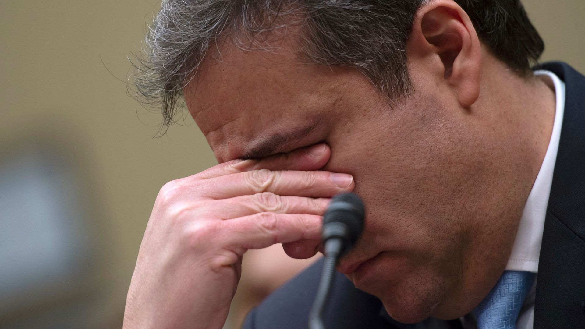 michael cohen putting his hands over his face