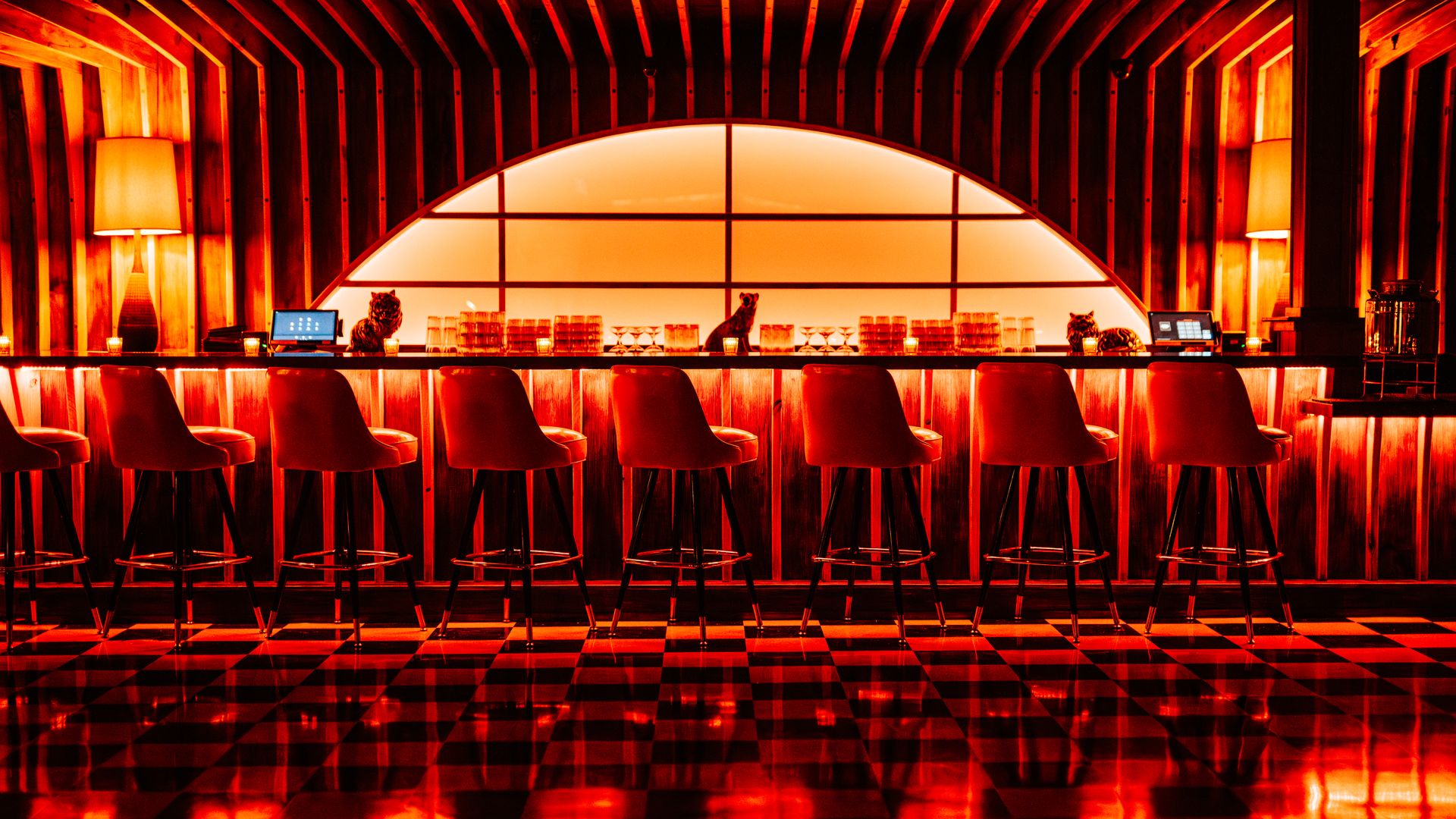 A row of chairs at a bar.