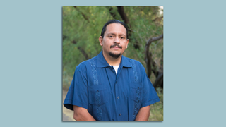 A man posing for a headshot.