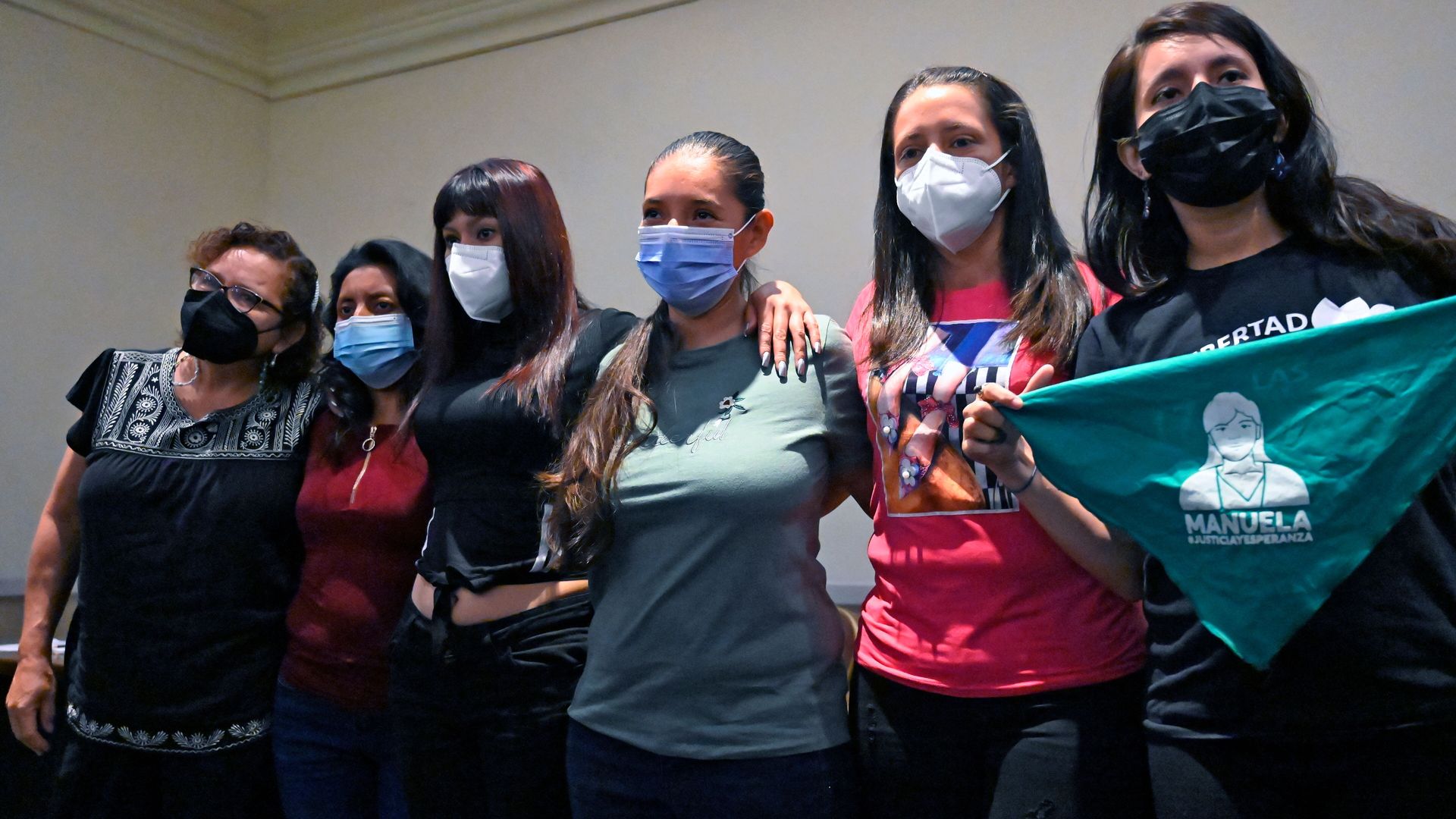 Salvadoran feminist leader Morena Herrera (L) poses with (L-R) Elsy, Kenia, Evelyn and Karen, who were imprisoned for several years accused of abortion after suffering an obstetric emergency