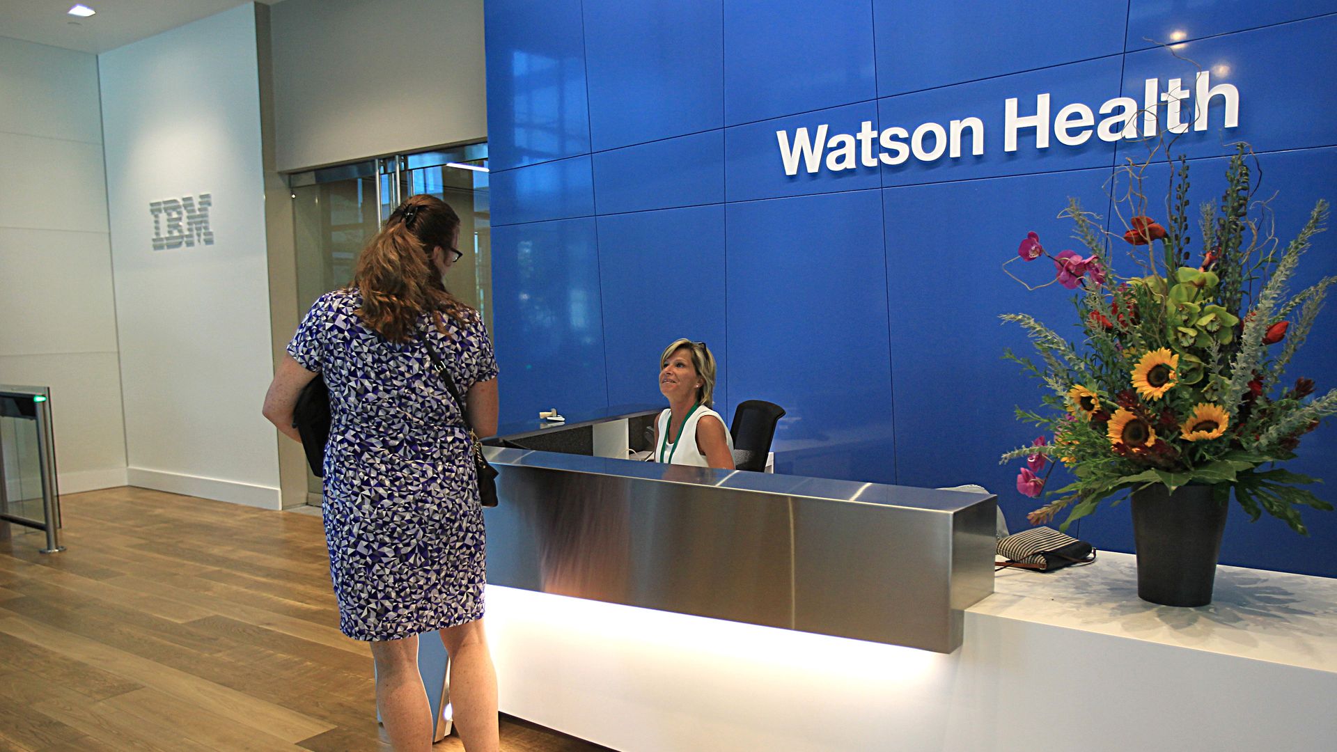 Two women in the lobby of IBM Watson Health headquarters in Massachusetts.