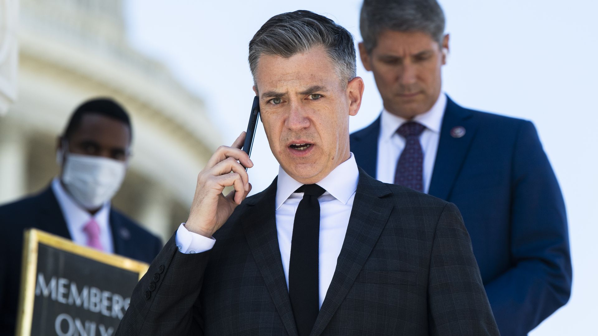Rep. Jim Banks is seen speaking on a cellphone.