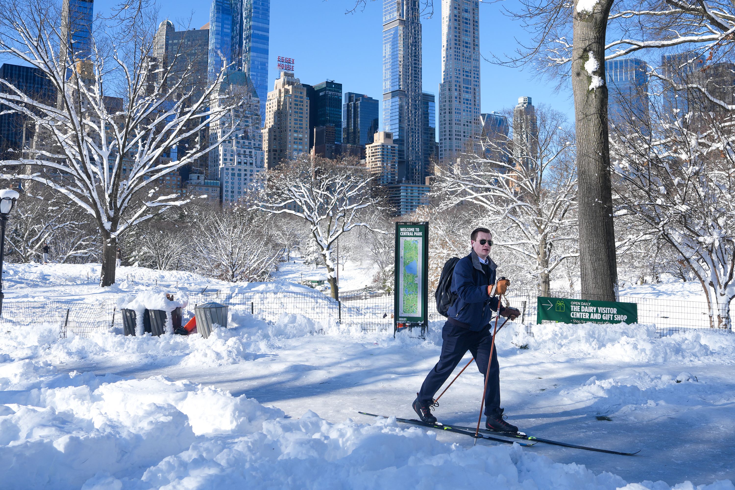 Man cross-country skies in snowy Central Park