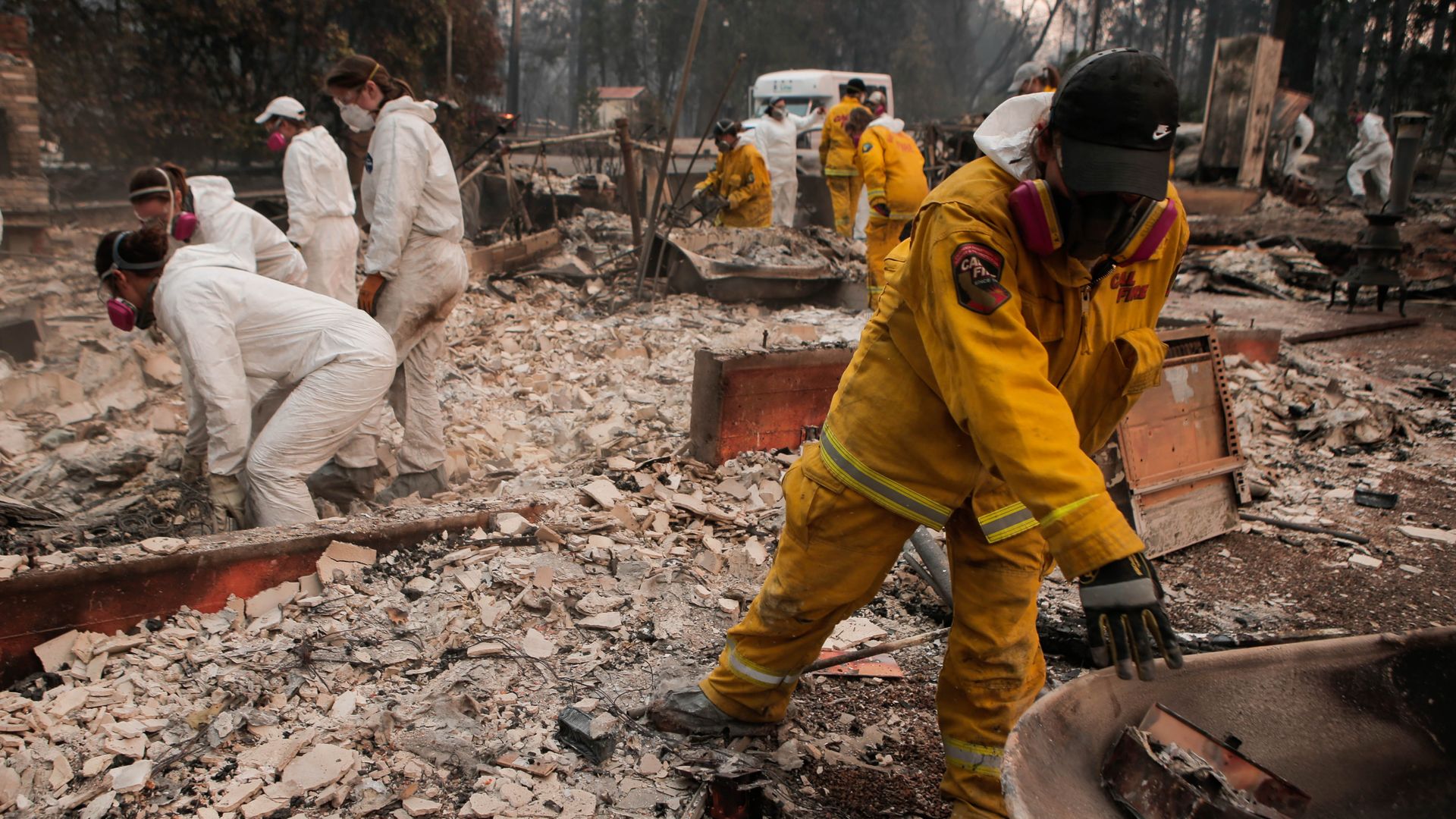 The Human Identification Laboratory sorts through fire rubble to try and find victims of the Camp Fire in Paradise, Calif. Sunday.