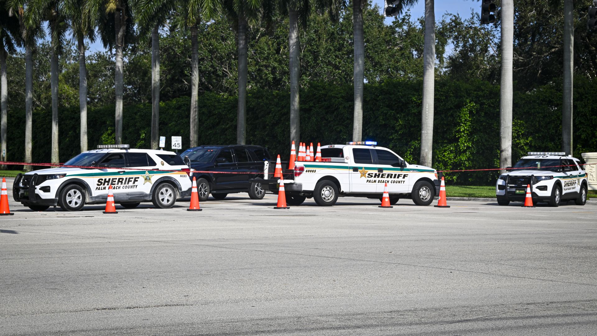 Law enforcement personnel investigate the area around Trump International Golf Club following an assassination attempt on former President Donald Trump on September 15, 2024 in West Palm Beach, Florida