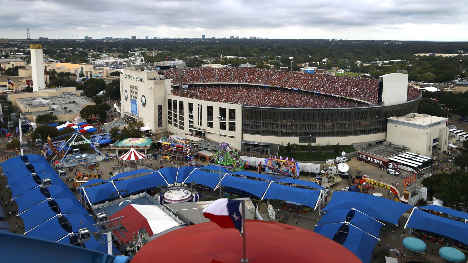 A "Cotton Bowl" stadium with fairgrounds in front of it