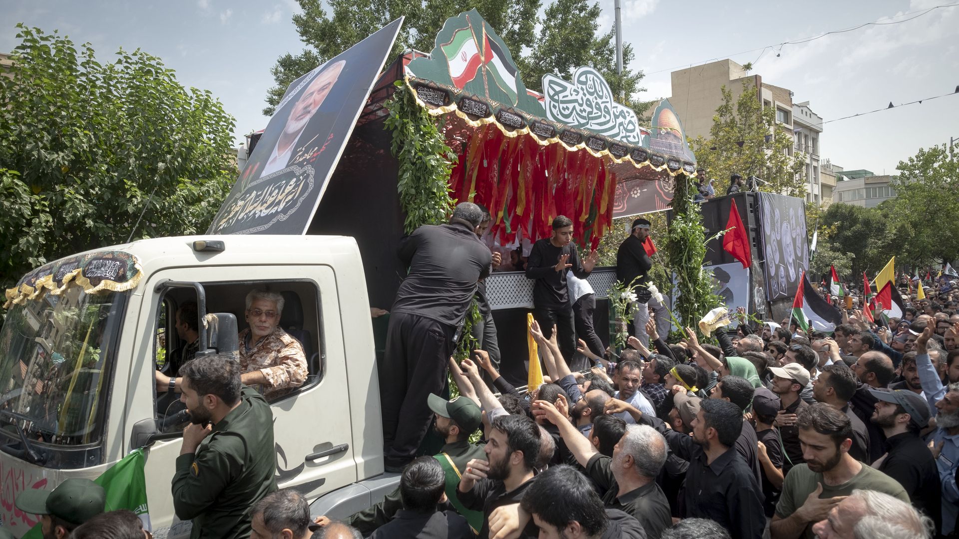 A truck carrying the coffins containing the bodies of Hamas leader Ismail Haniyeh and his bodyguard Abu Shaaban during a funeral ceremony in Tehran, Iran, on August 1, 2024.