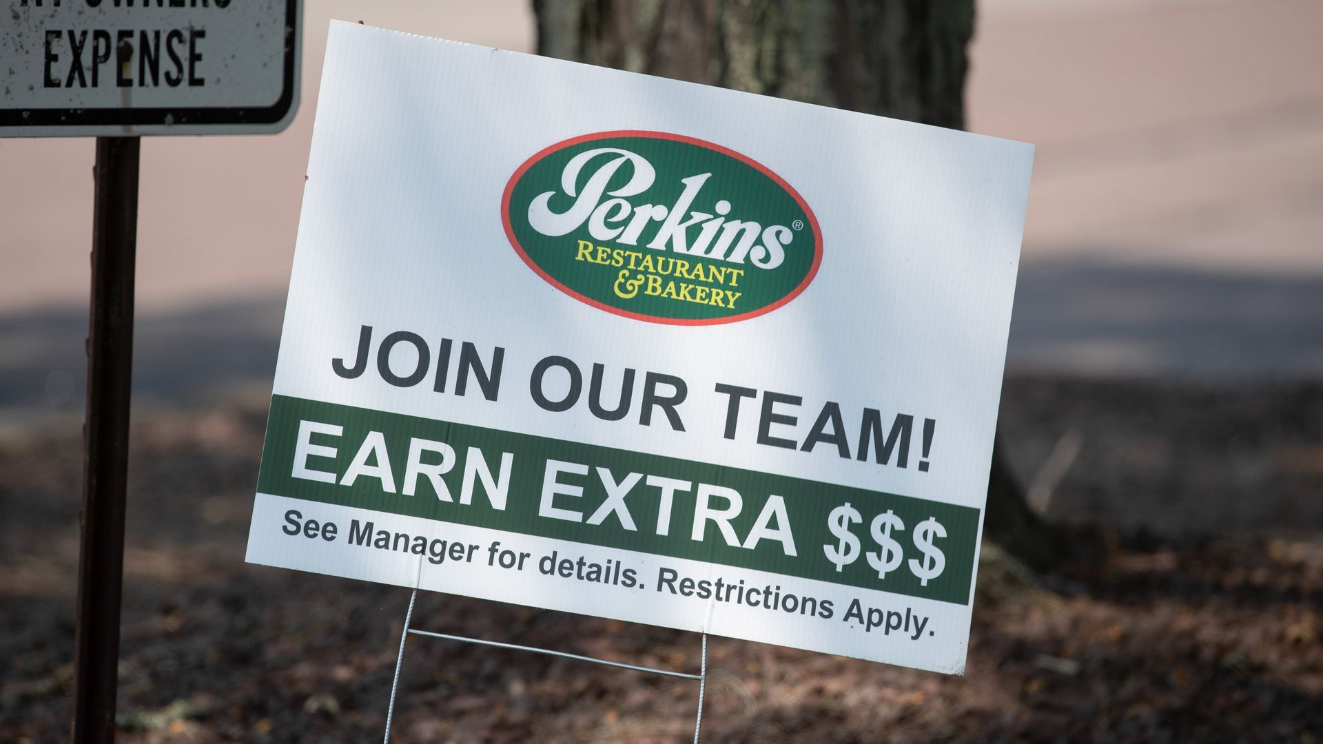Photo of a sign that says "Join our team! Earn extra $$$"