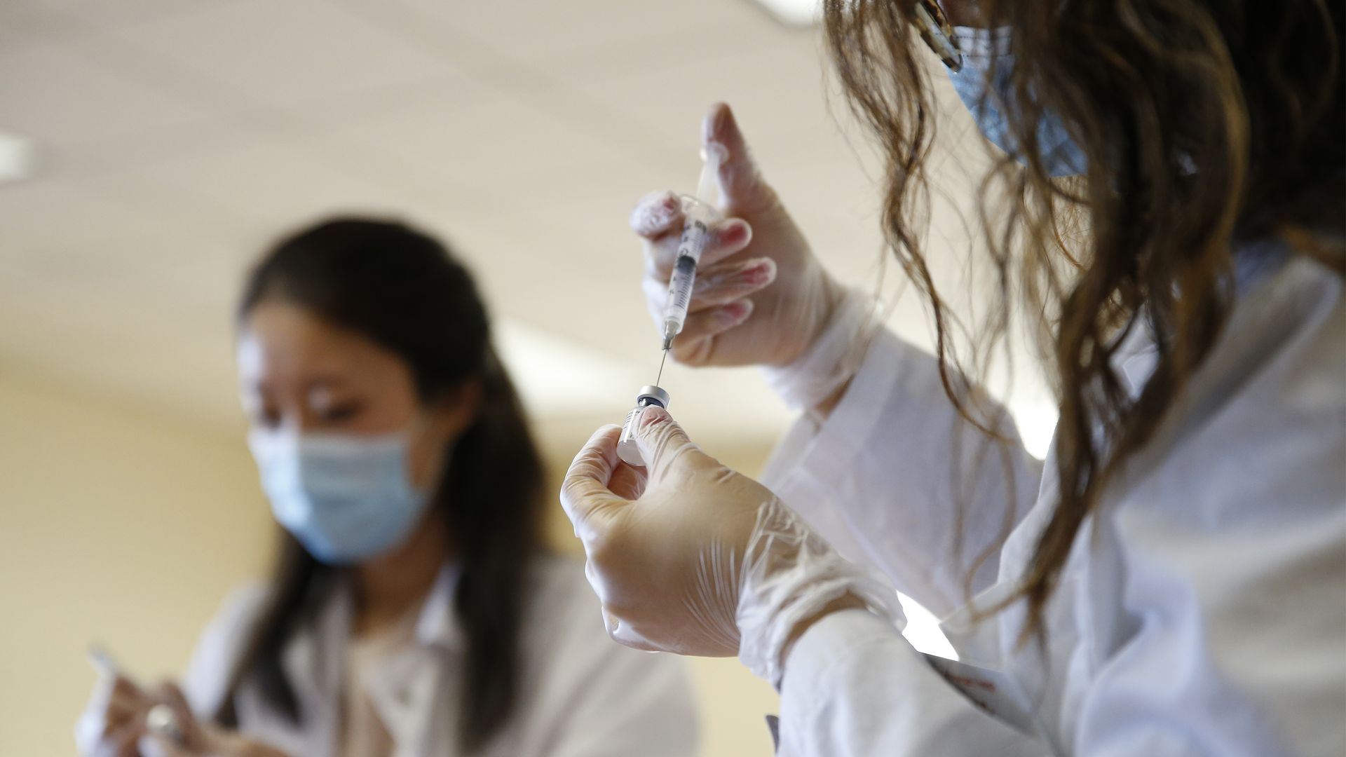 Pharmacists prepare the Pfizer-BioNTech COVID-19 vaccine 