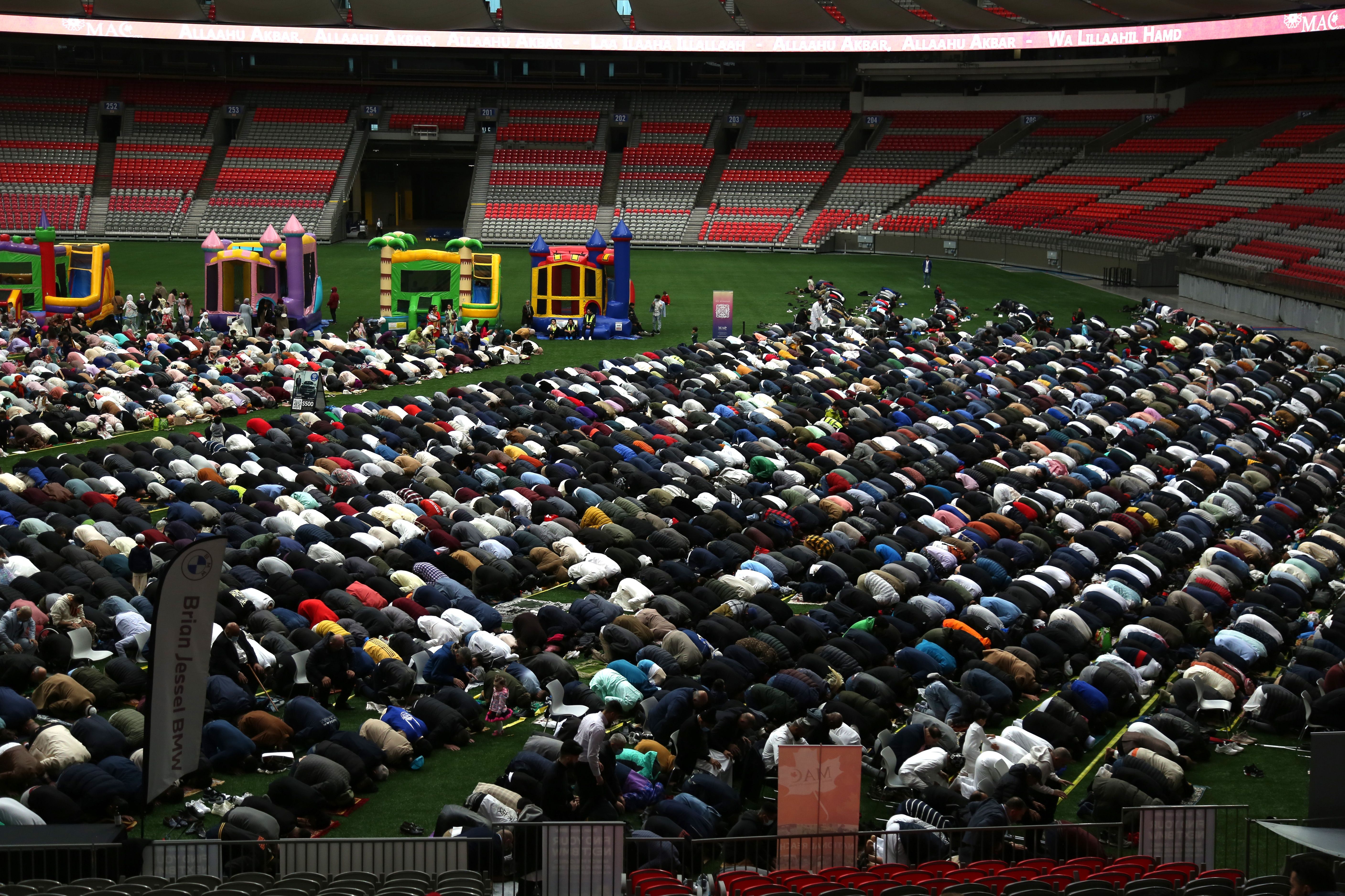  Muslims perform the prayer of Eid al-Fitr at BC Place Stadium in Vancouver, British Columbia, Canada on May 2, 2022. (Photo by Mert Alper Dervis/Anadolu Agency via Getty Images)