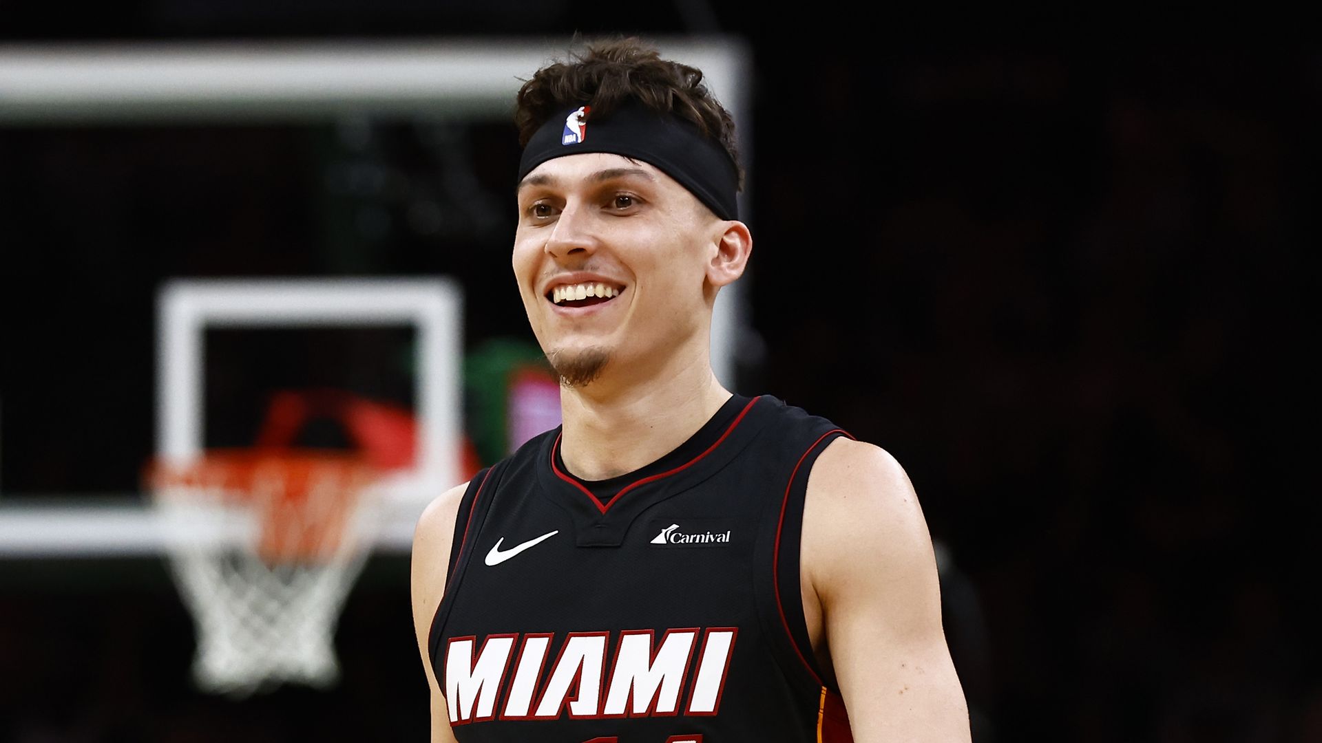 Tyler Herro smiles during Game 2 of the Eastern Conference First Round Playoffs