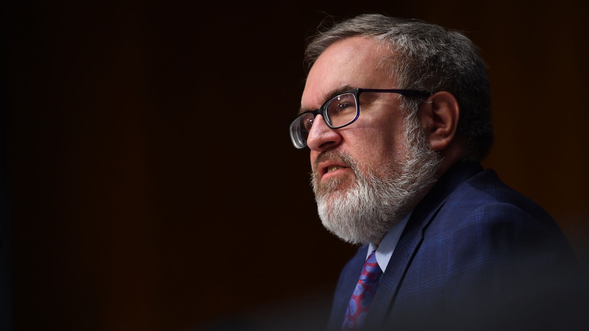 Andrew Wheeler sits in a suit and tie
