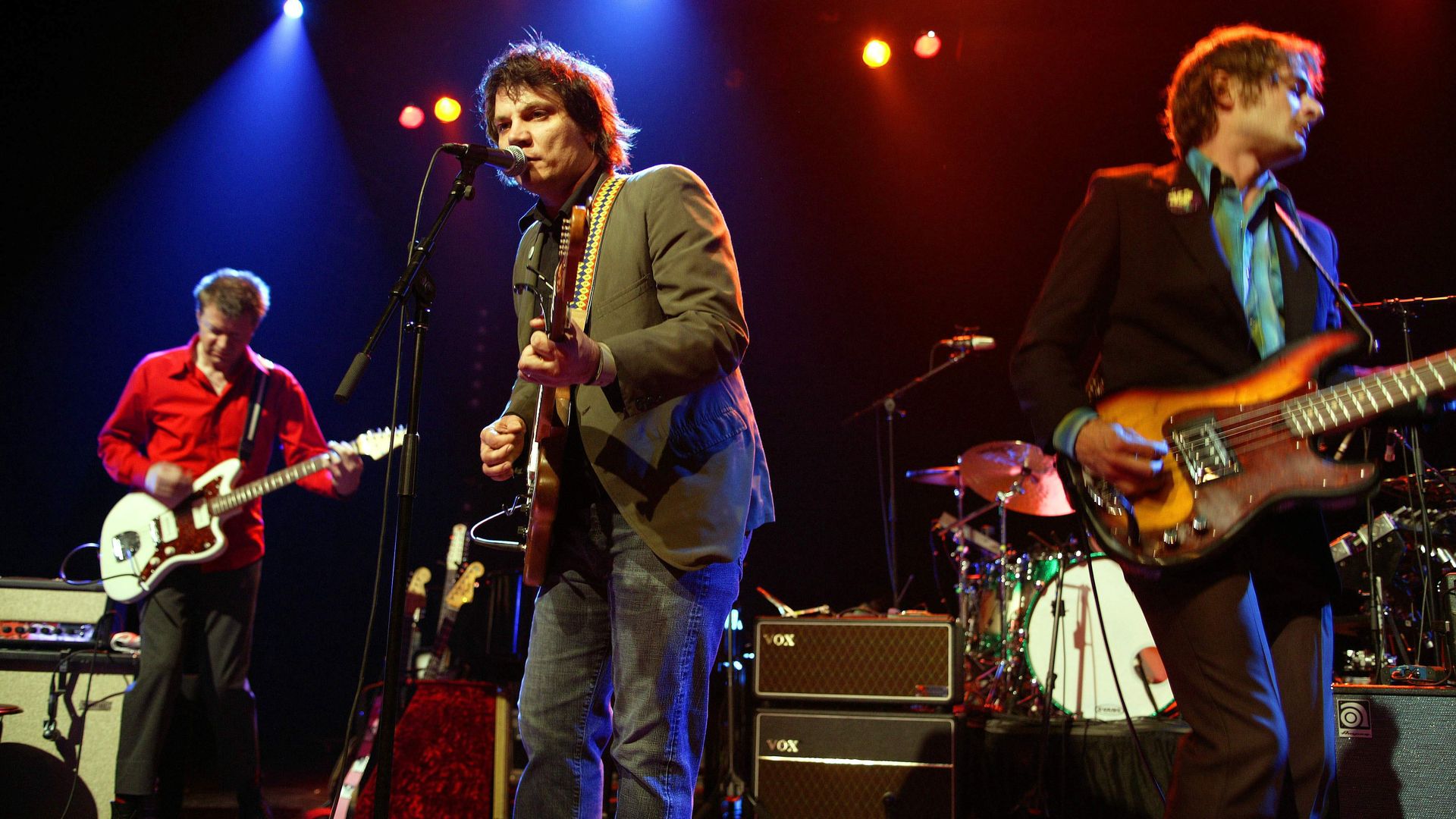 Photo of a band playing on stage.