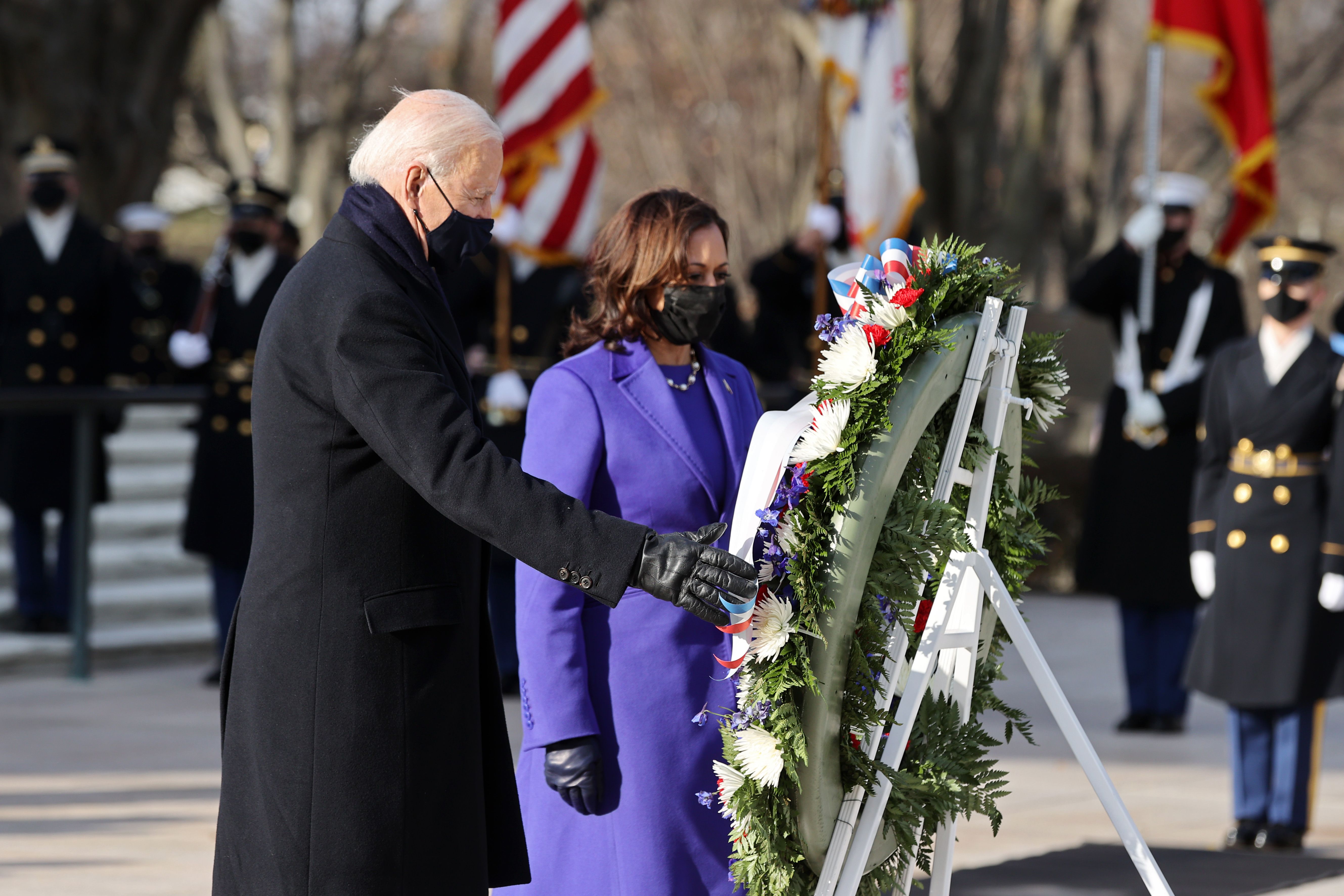 Biden and Harris pay their respects in front of a wreath at the Tomb of the Unknown Soldier.
