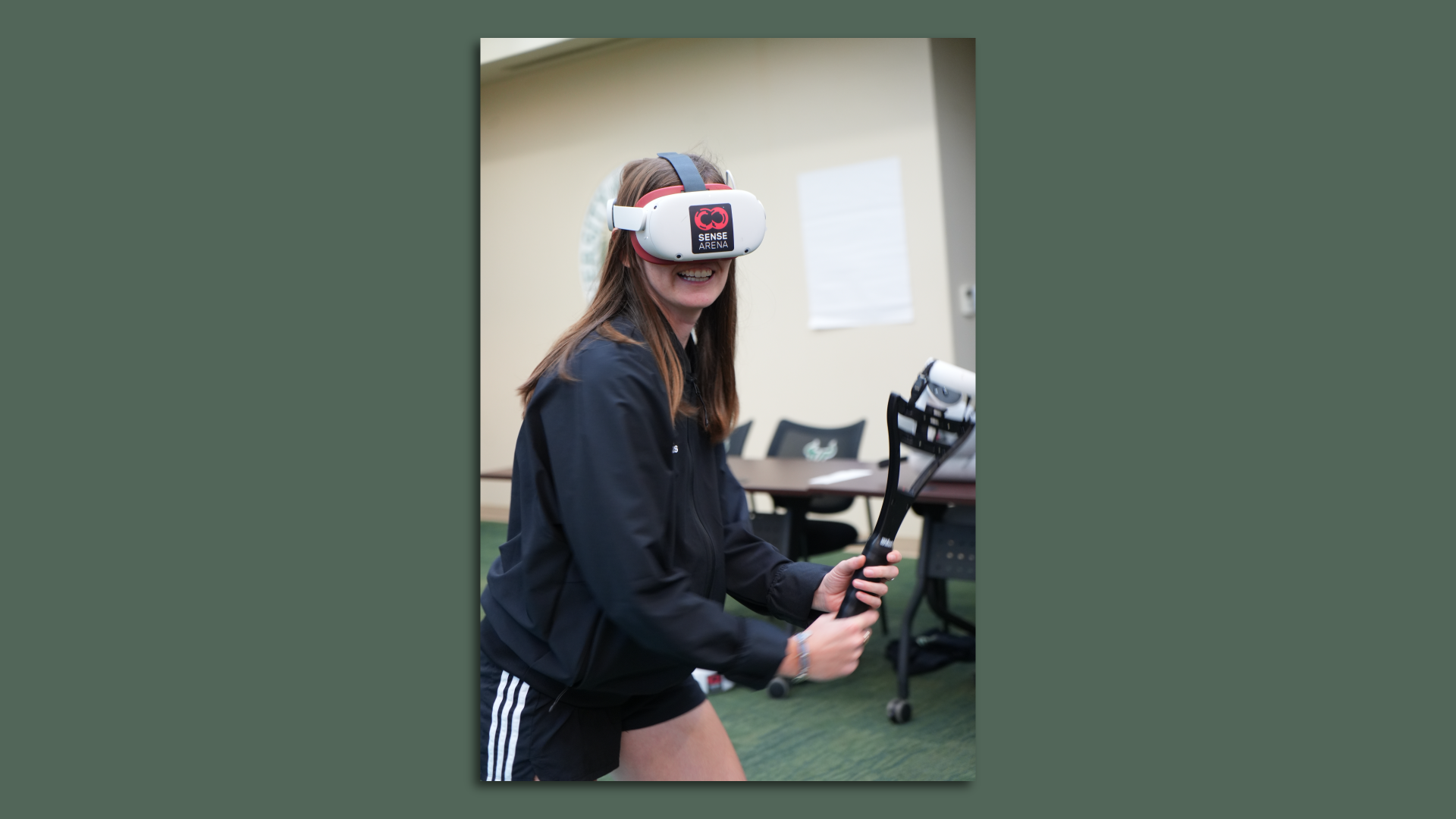A female uses virtual reality headset and raquet to practice tennis.
