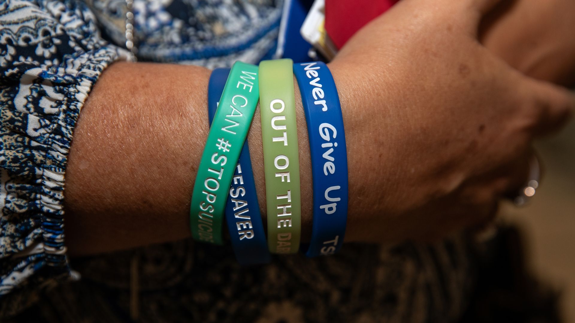 Shannon Geames from Tennessee wears suicide prevention wristbands.