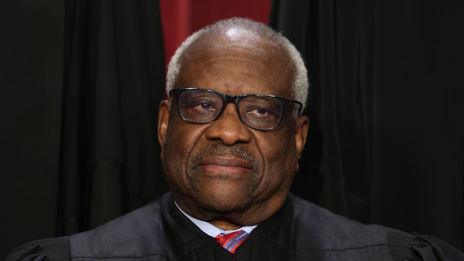 Supreme Court Associate Justice Clarence Thomas poses for an official portrait at the East Conference Room of the Supreme Court building on October 7, 2022