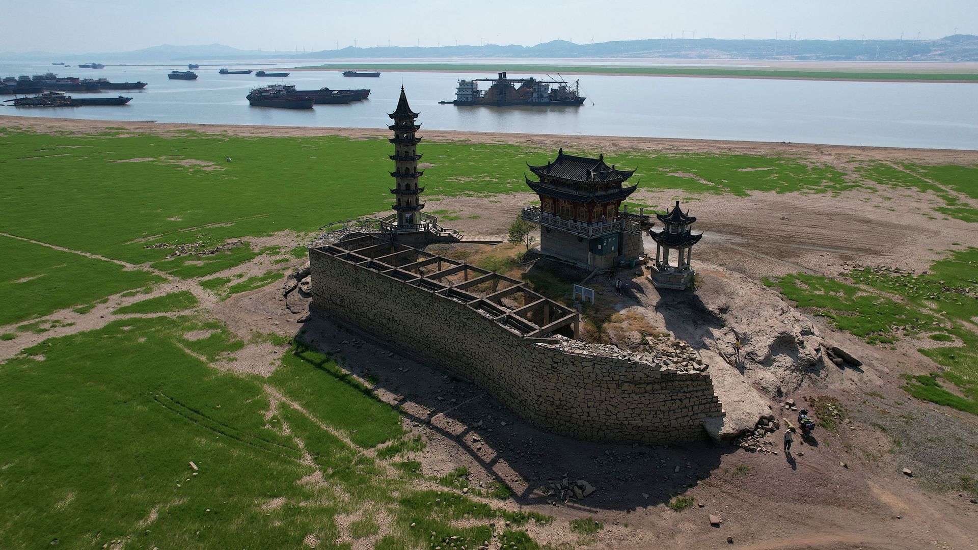 the usually half submerged in water Luoxing Dun, a small island with ancient temples on it, in China's largest freshwater Poyang Lake in Juijiang, China's central Jiangxi province on August 23, 2022.