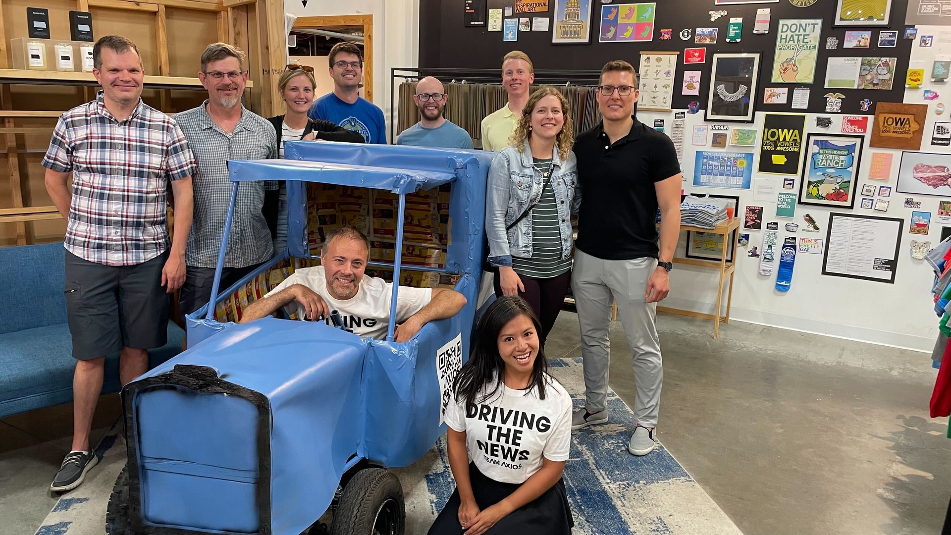 Photo of people in a go-kart like car. 
