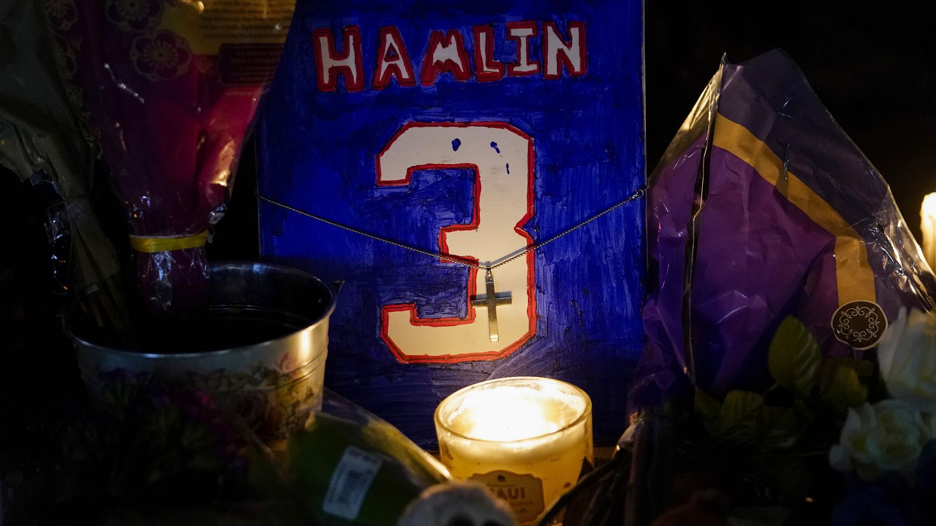 Fans hold a candlelight vigil for Buffalo Bills safety Damar Hamlin at University of Cincinnati Medical Center on Tuesday.