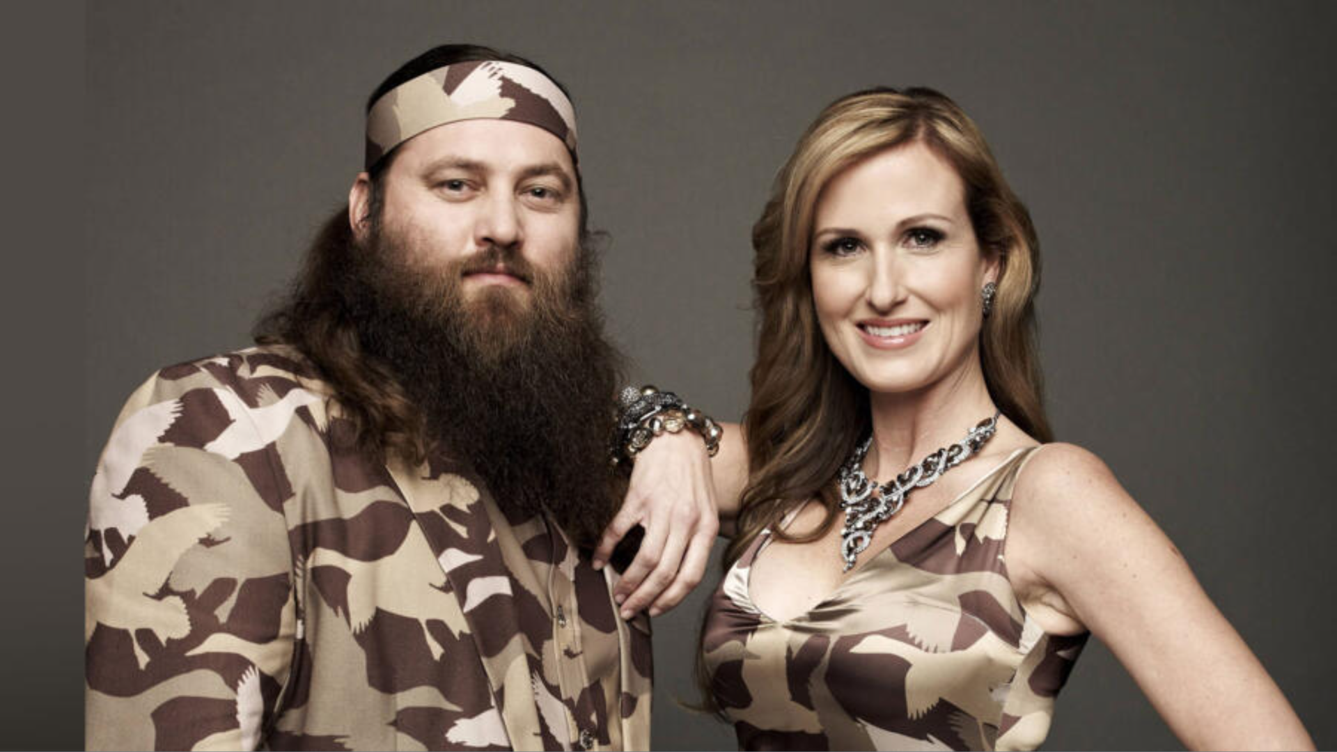 Photo shows a man and a woman in camo clothes.