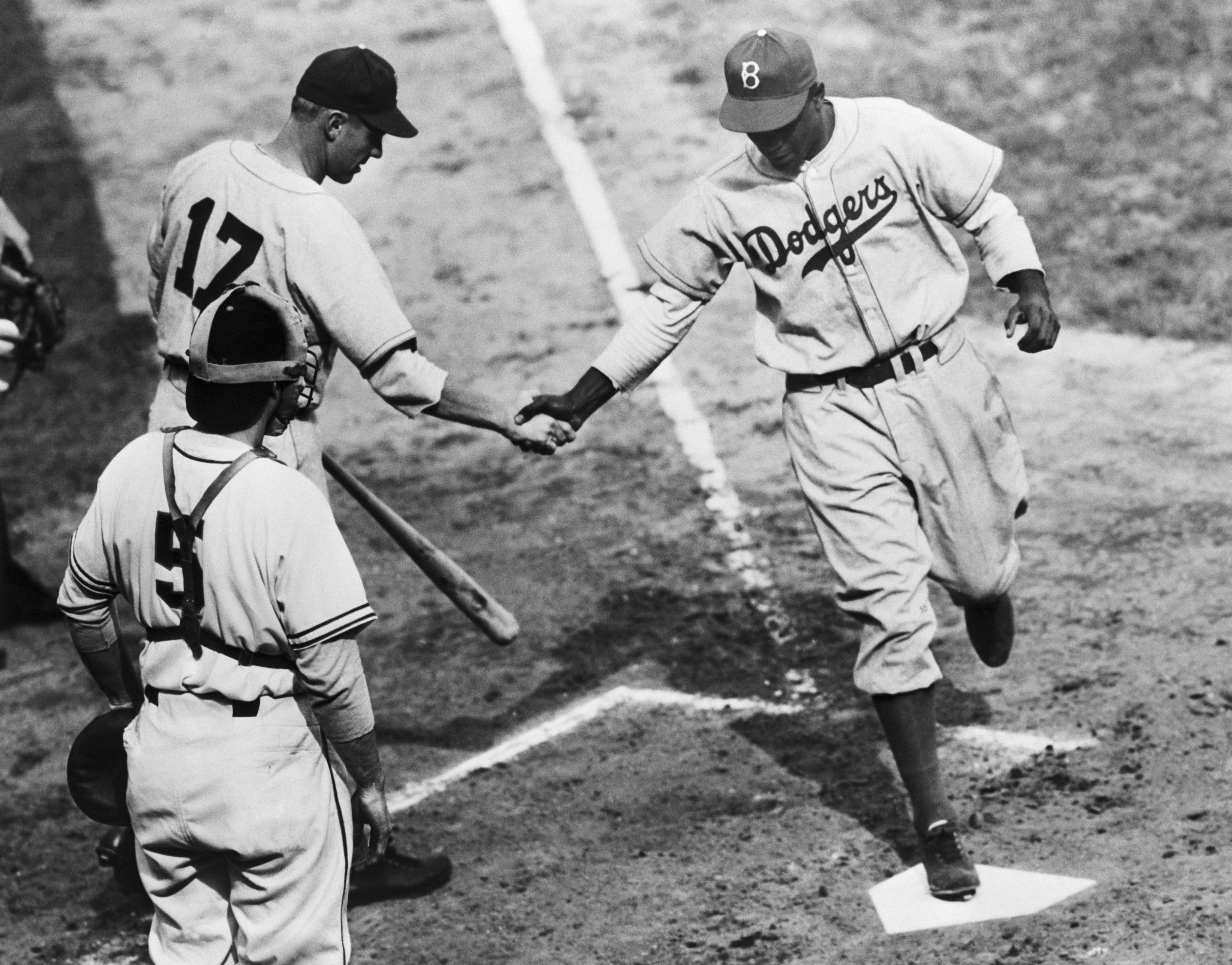Jackie Robinson of the Brooklyn Dodgers crosses homeplate on April 18, 1947  at the Polo Grounds in New York.