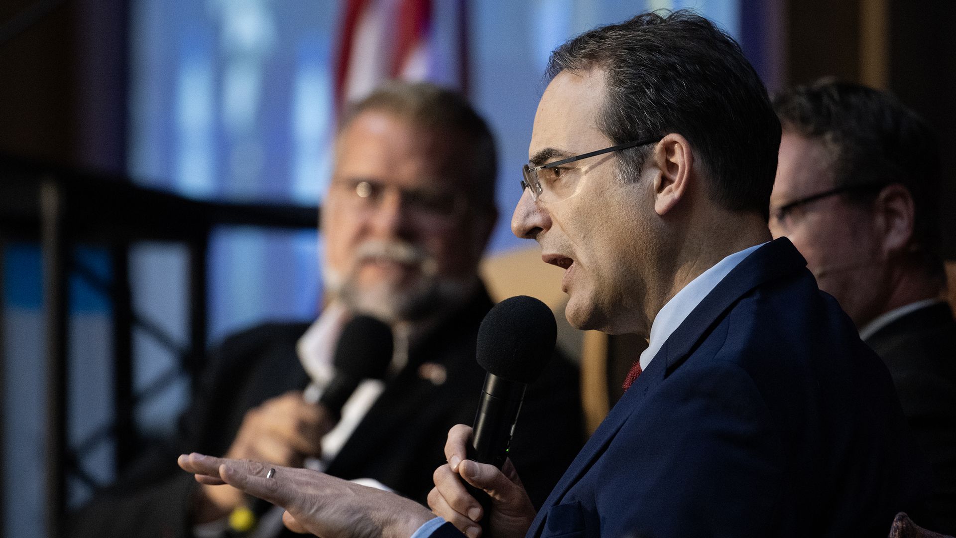 Colorado Attorney General Phil Weiser, center, responds to his opponent Victor Marx during a gubernatorial forum Oct. 8. Photo: Timothy Hurst/Denver Post via Getty Images