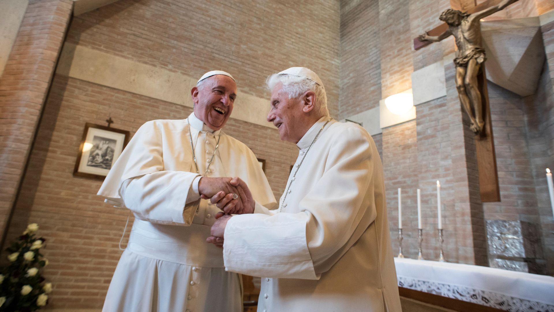 Pope Francis (L) and Pope Benedict (R)
