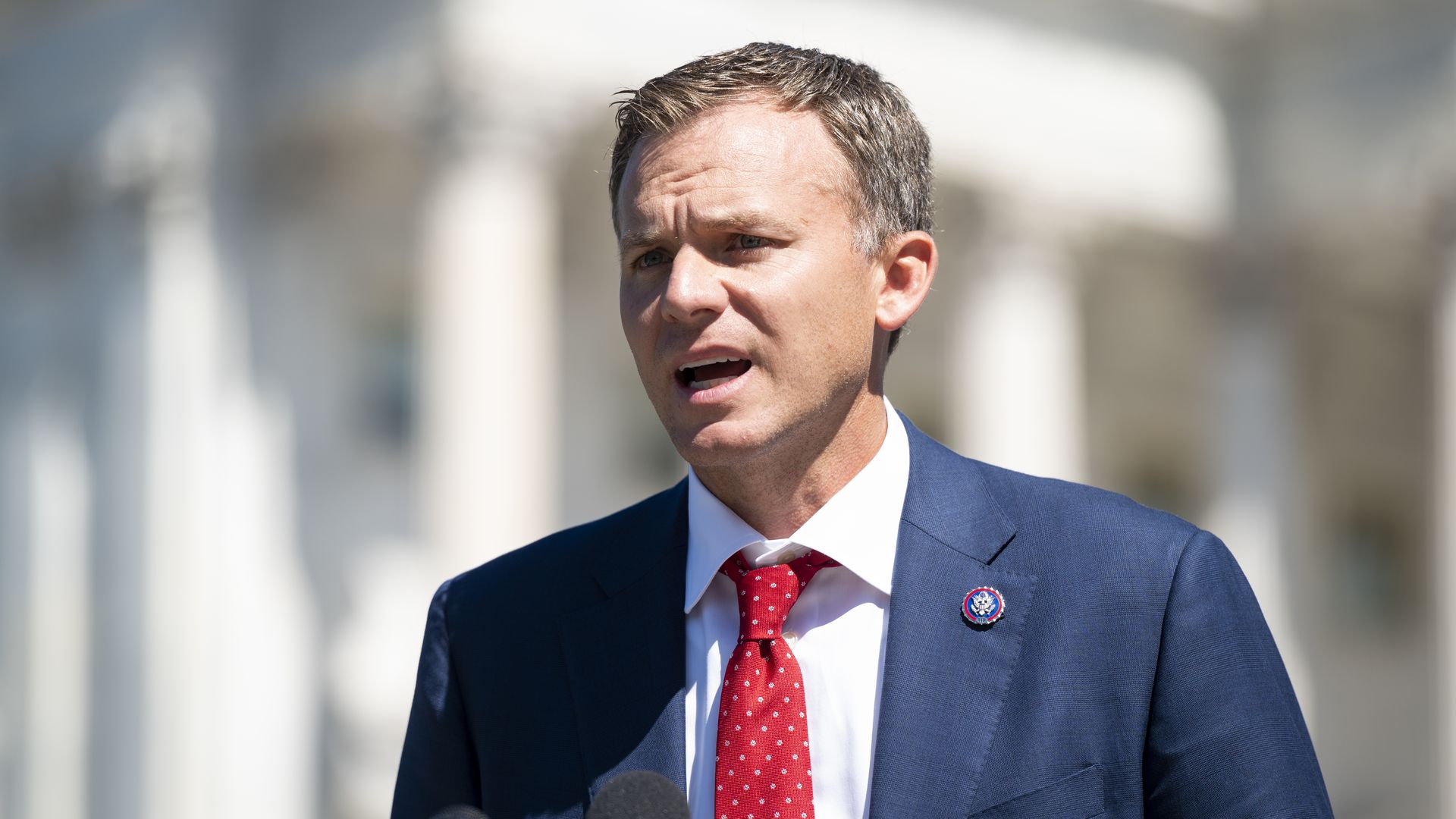 Rep. Blake Moore is seen speaking in front of the U.S. Capitol.