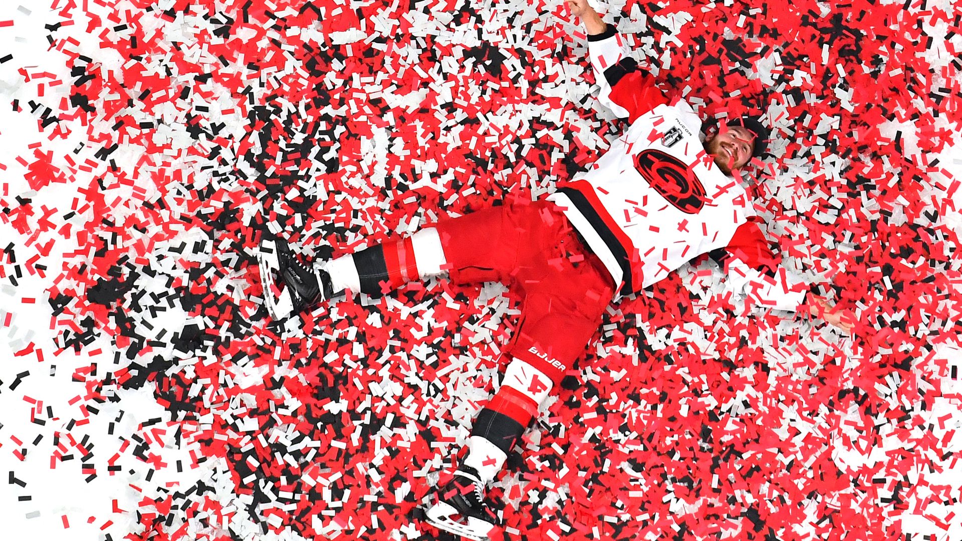 Andrei Svechnikov #37 of the Carolina Hurricanes poses for a photo in confetti on the ice after winning the Stanley Cup in Las Vegas.